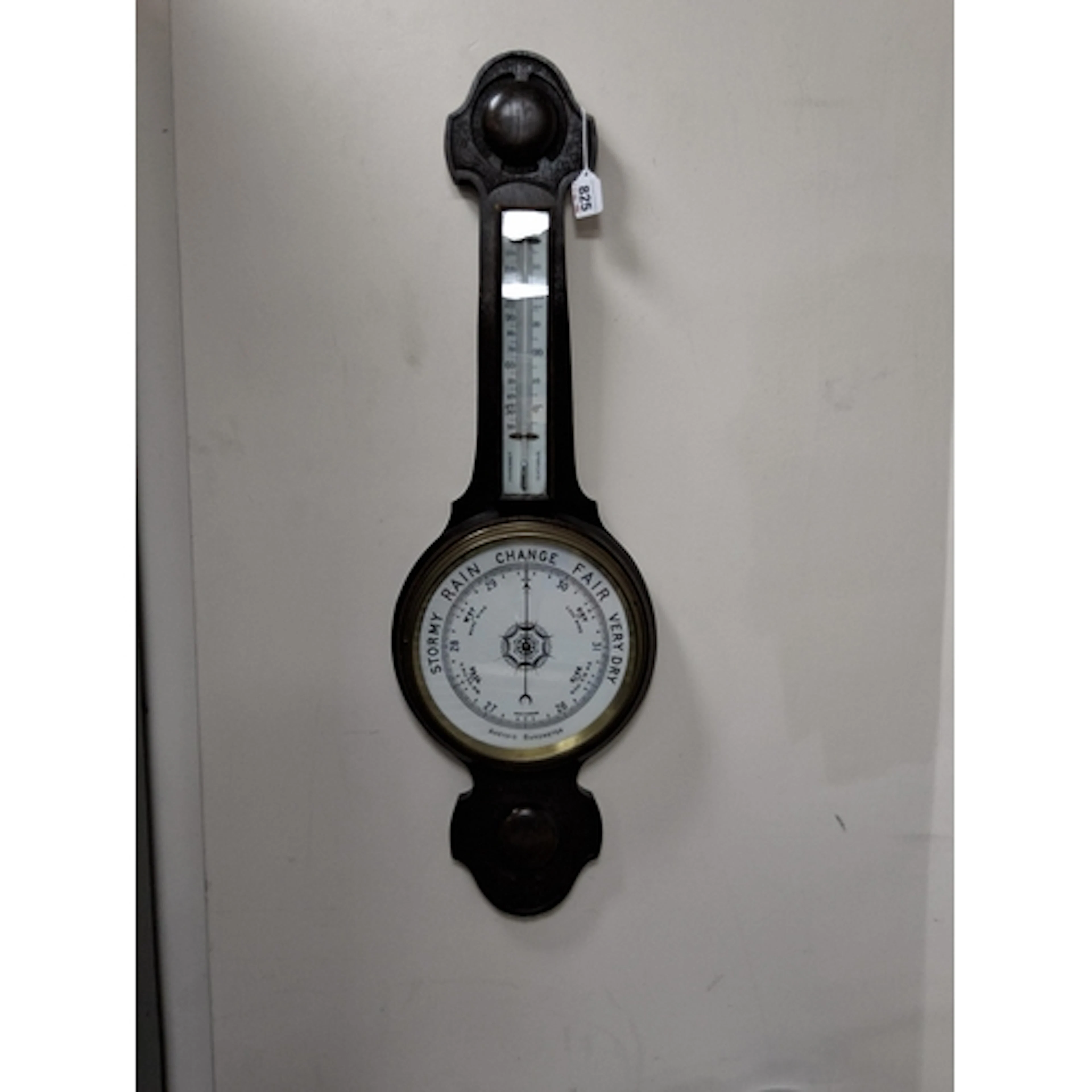 AN ANEROID BAROMETER, banjo style, with thermometer, marked ...