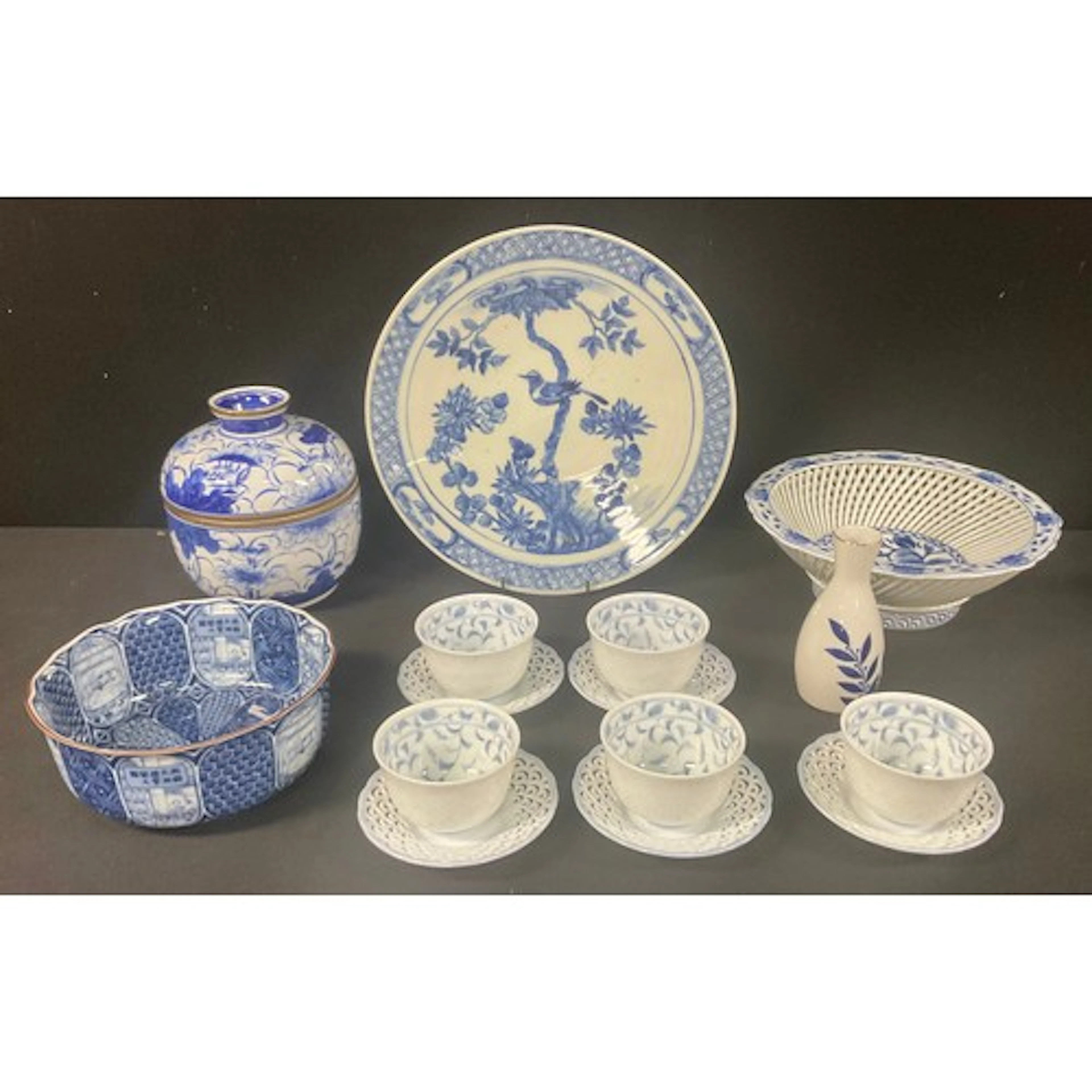 A Japanese porcelain shaped circular lattice bowl, decorated...