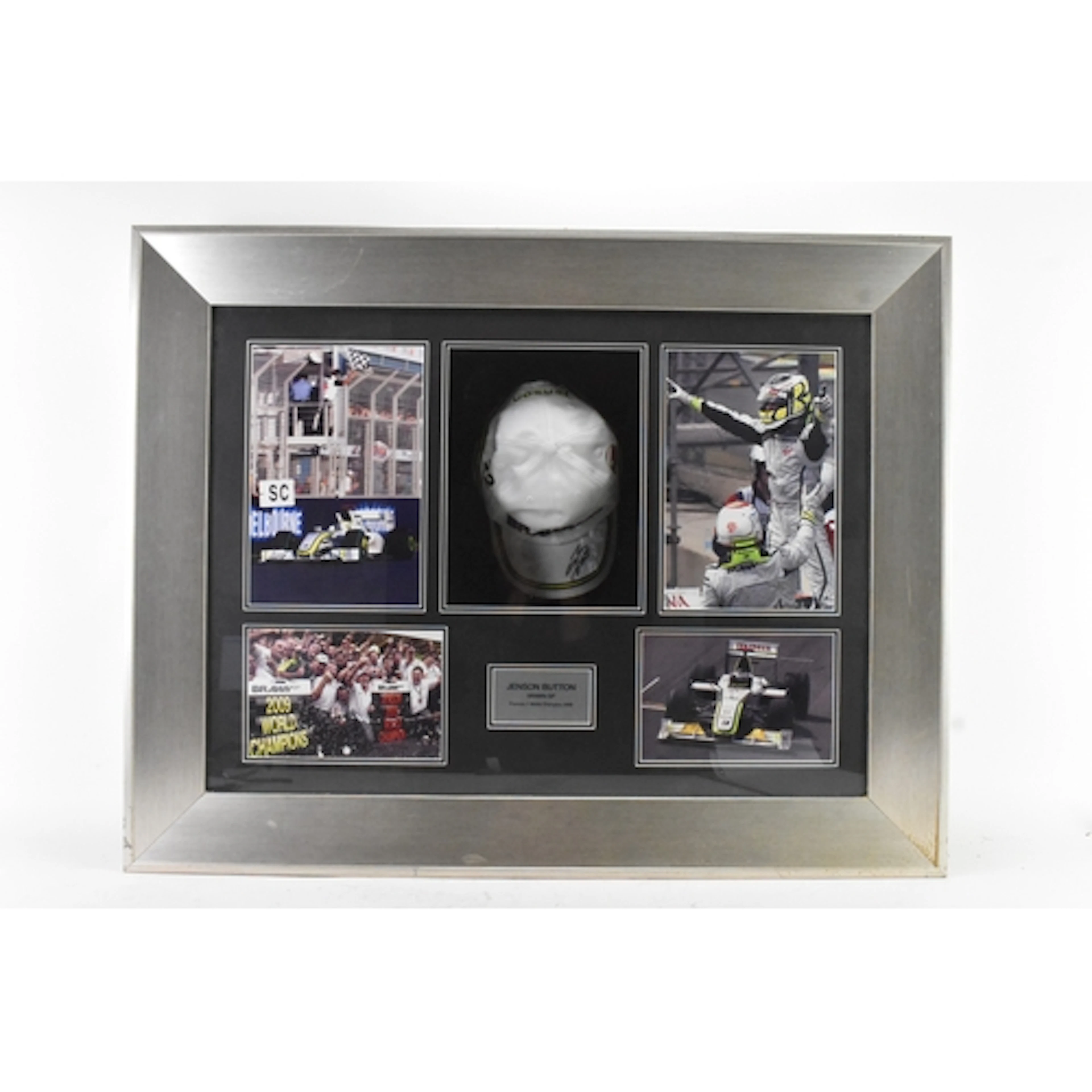 A framed Jenson Button signed Brawn GP Formula 1 World Champ...