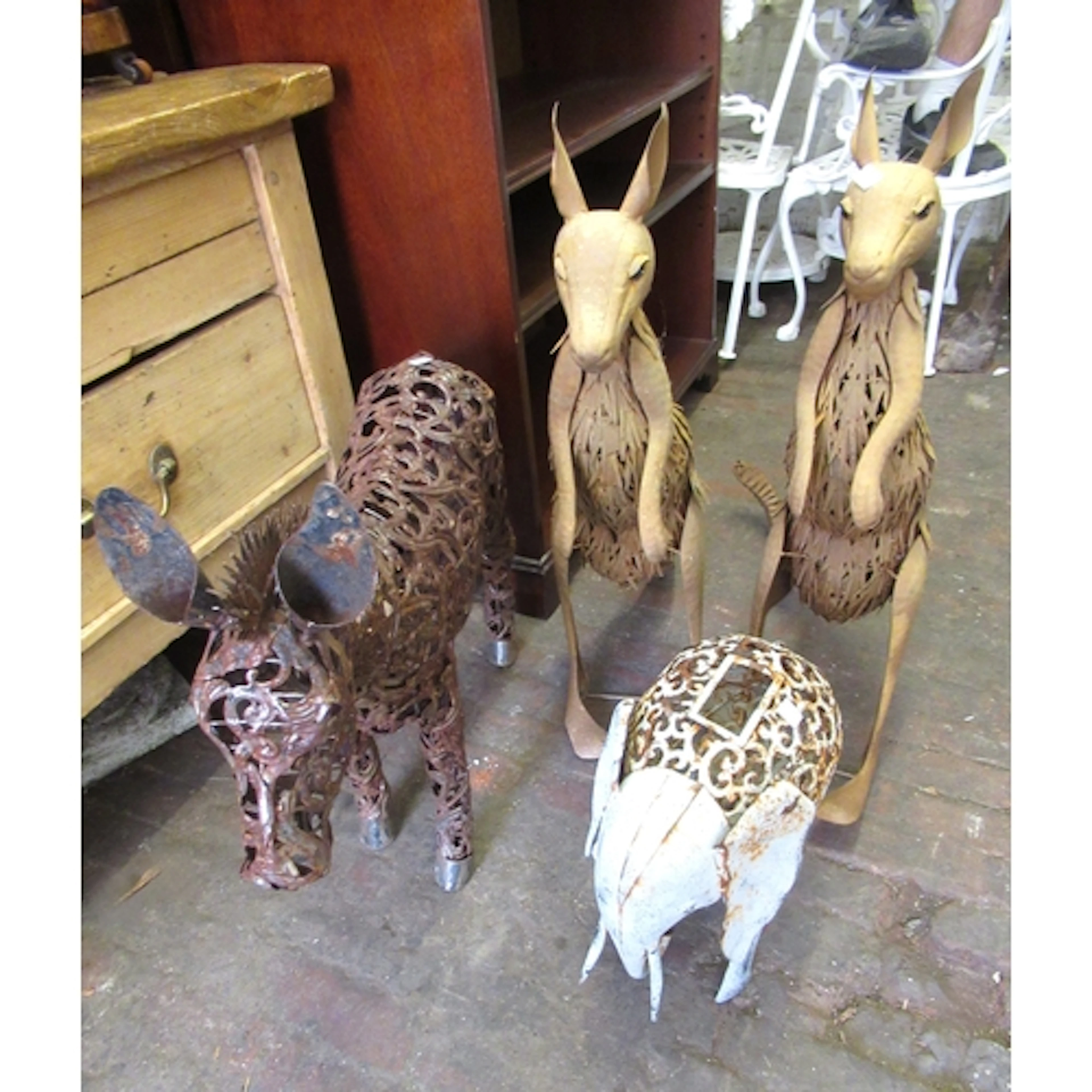 Two metal garden sculptures of wallabies, smaller figure of ...
