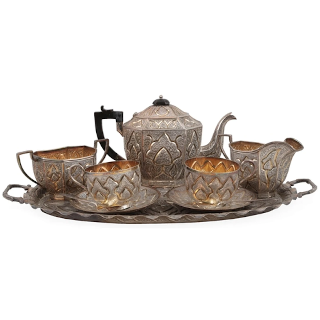 An Indian Colonial Kashmir white metal tea service, comprisi...
