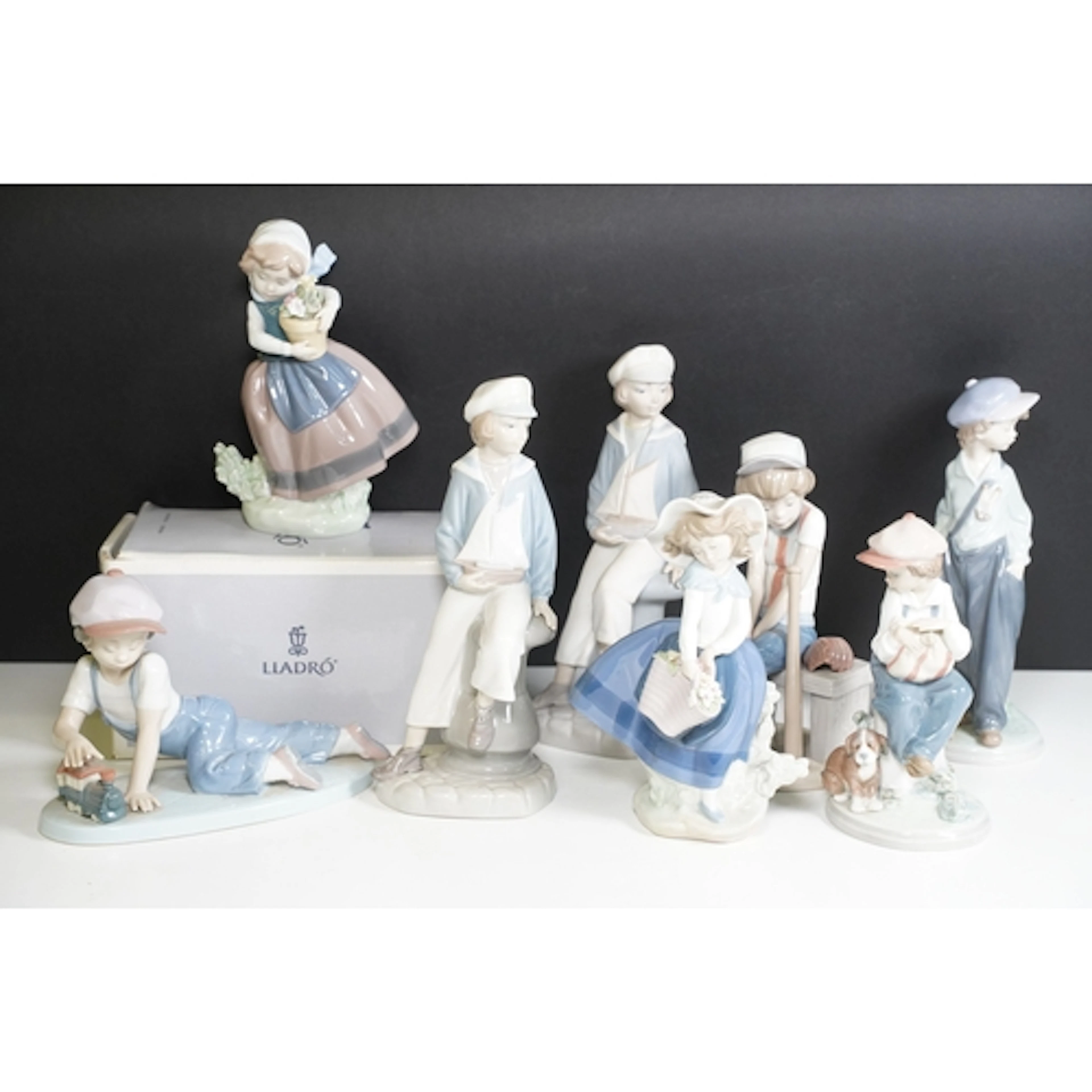 Group of eight Lladro figures, to comprise 5400, 7619, boy p...