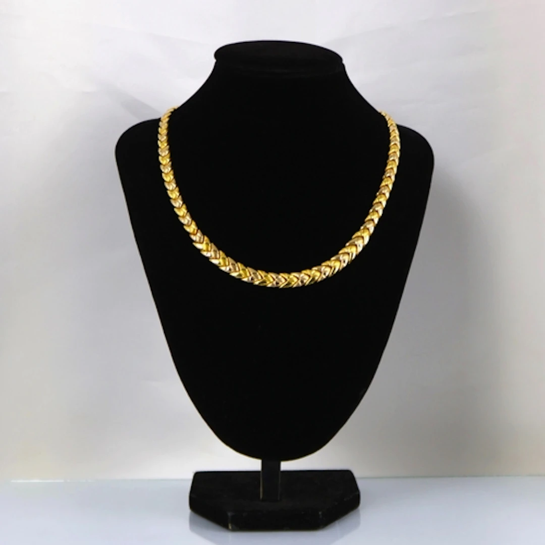 A contemporary yellow metal necklace, possibly Italian, the ...
