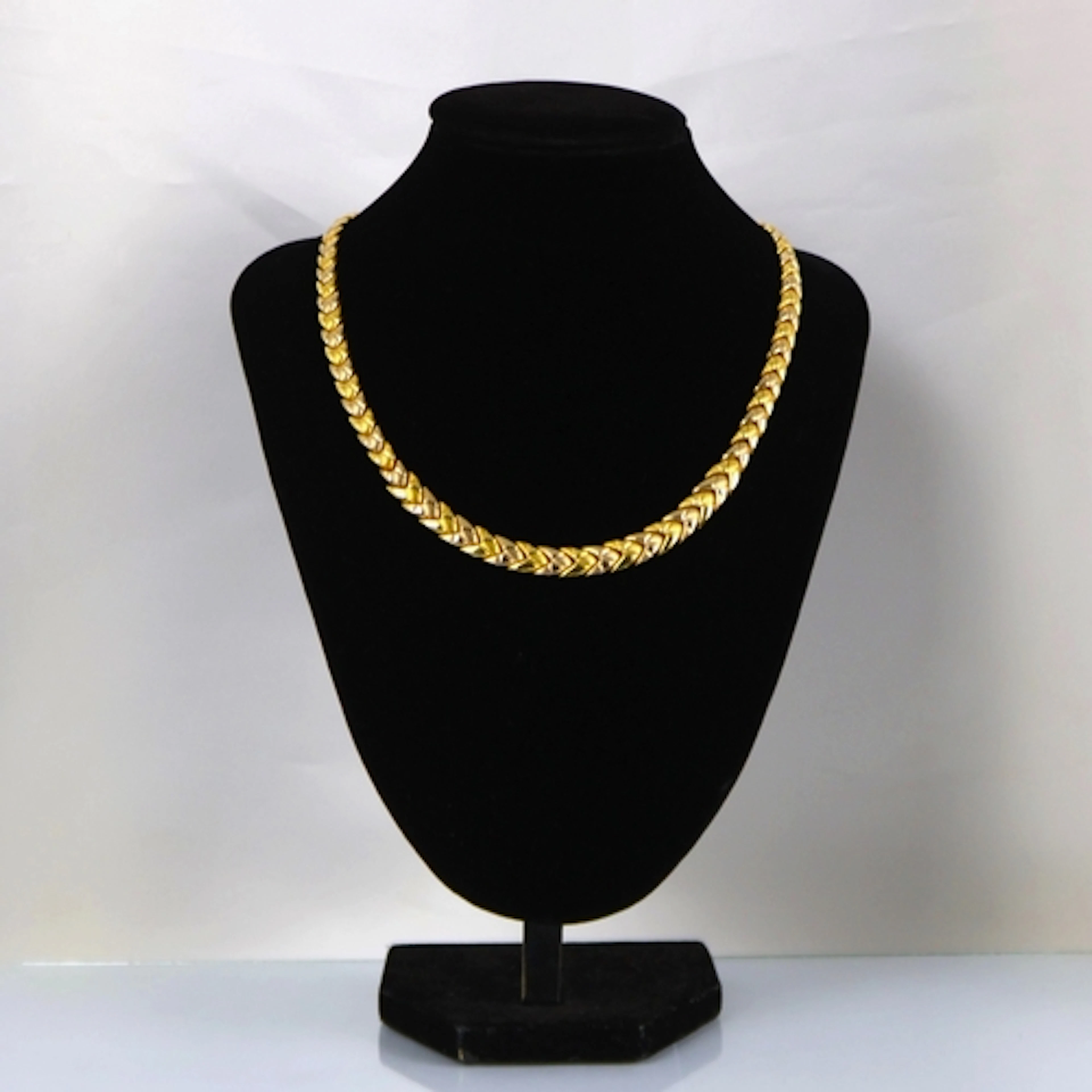 A contemporary yellow metal necklace, possibly Italian, the ...