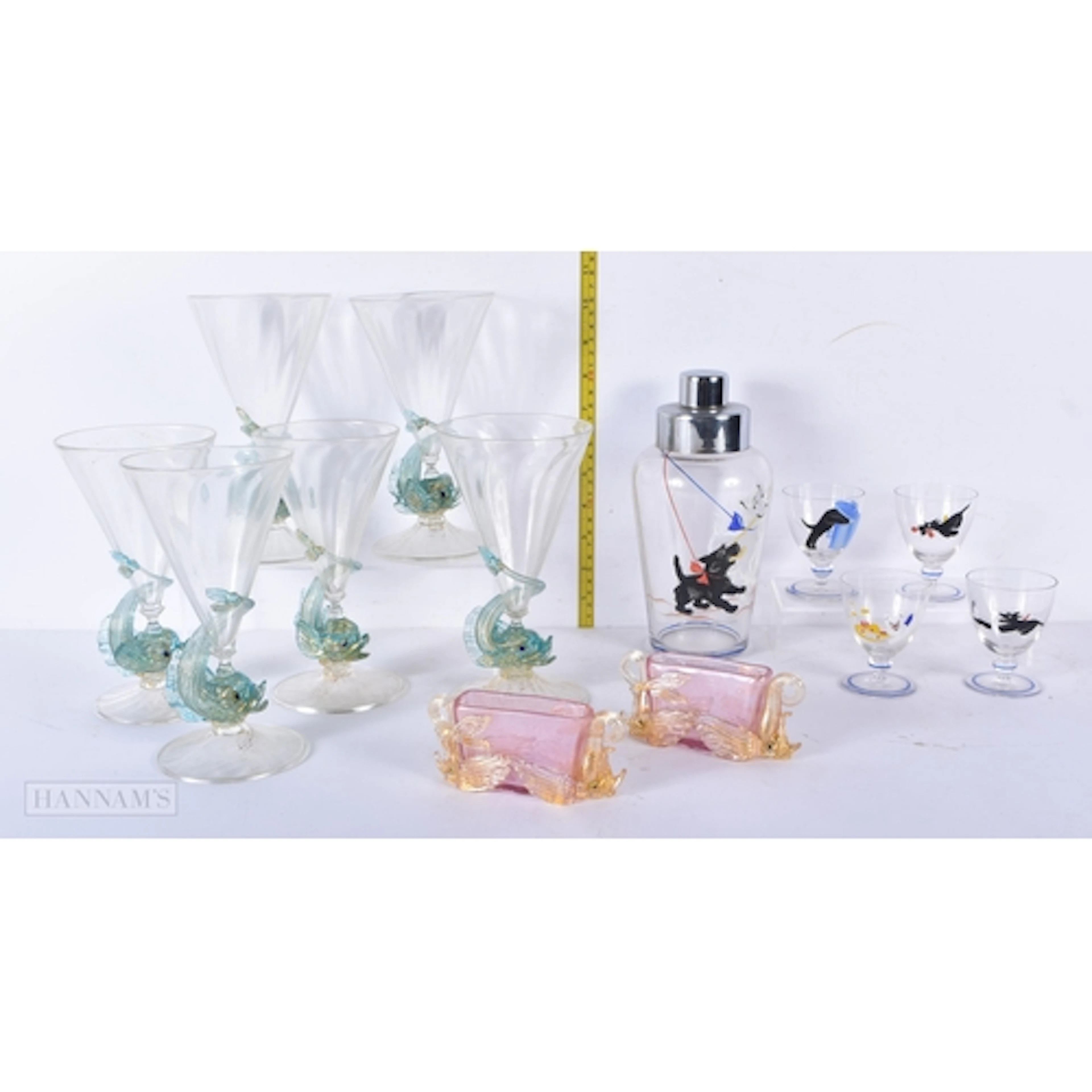 A collection of Venetian figural Dolphin glasses together wi...