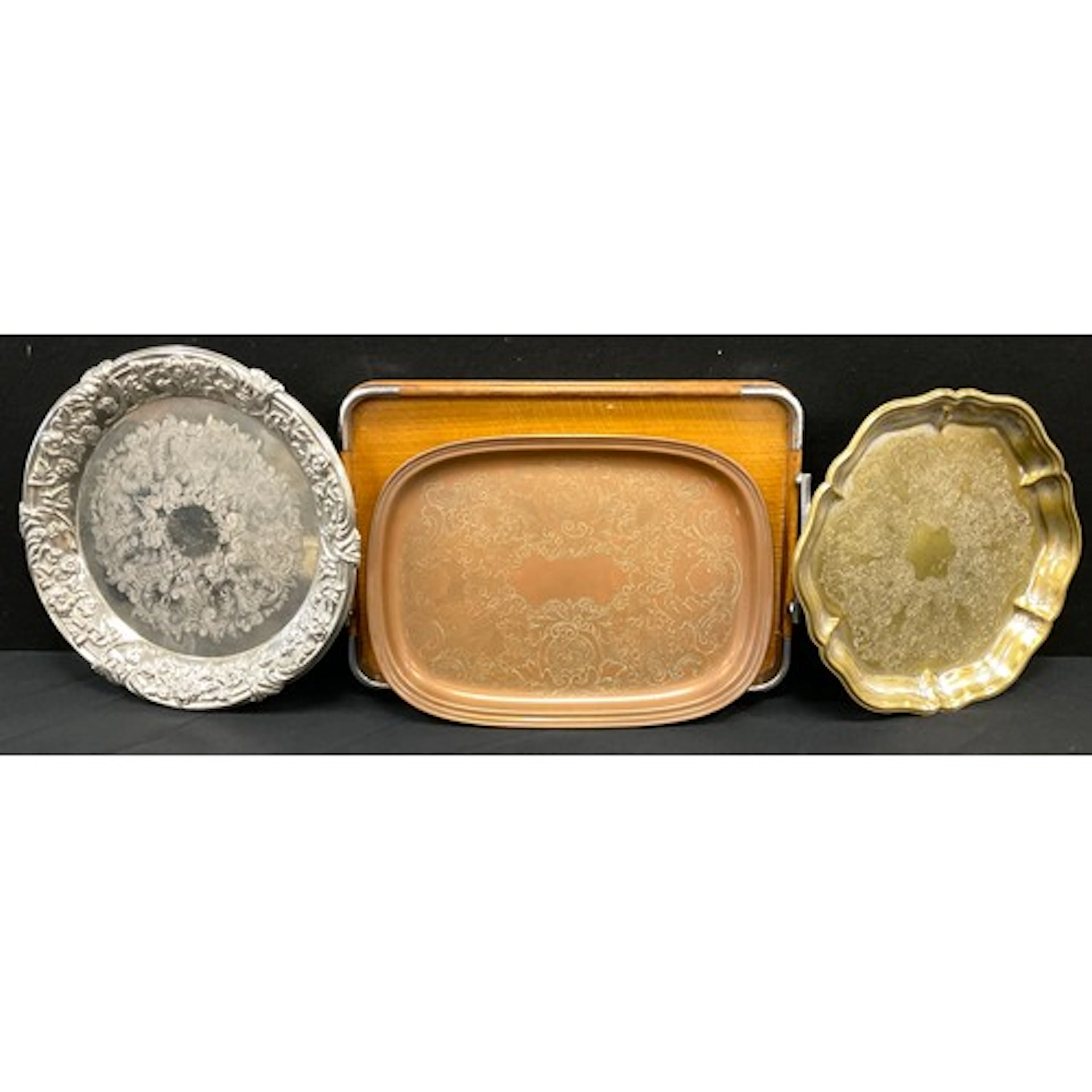 A collection of vintage trays, silver-plated with embossed f...
