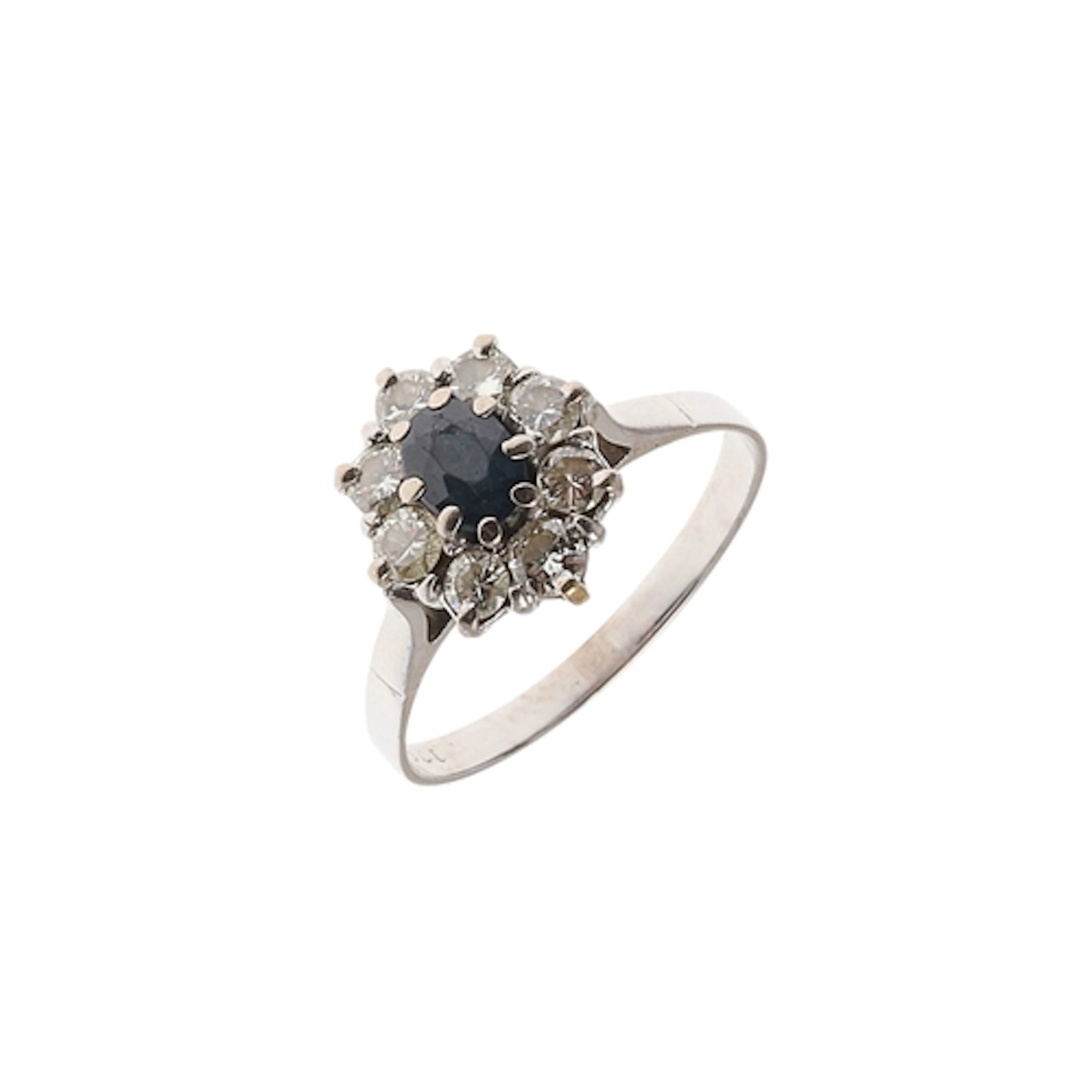 A SAPPHIRE AND DIAMOND CLUSTER RING. the oval-shaped sapphir...