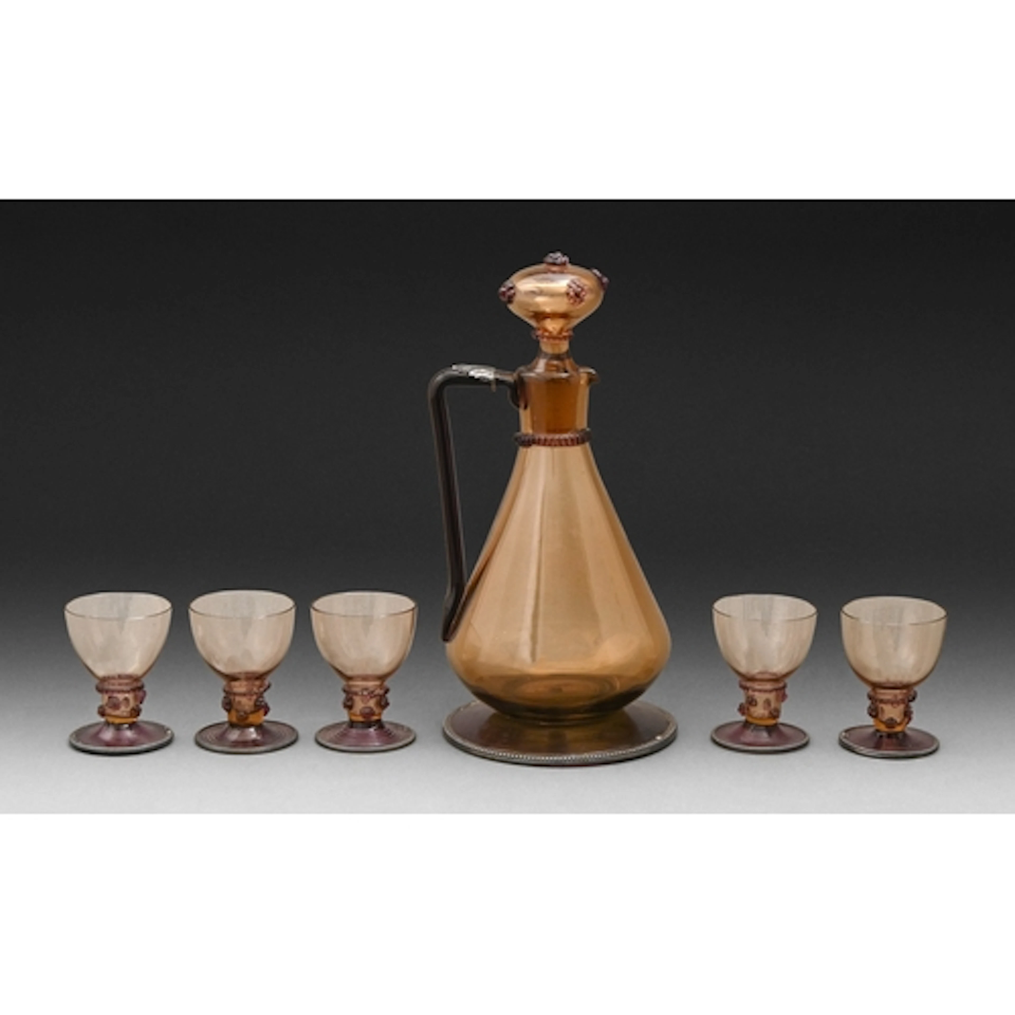 A Bohemian olive and amethyst glass liqueur set, late 19th c...