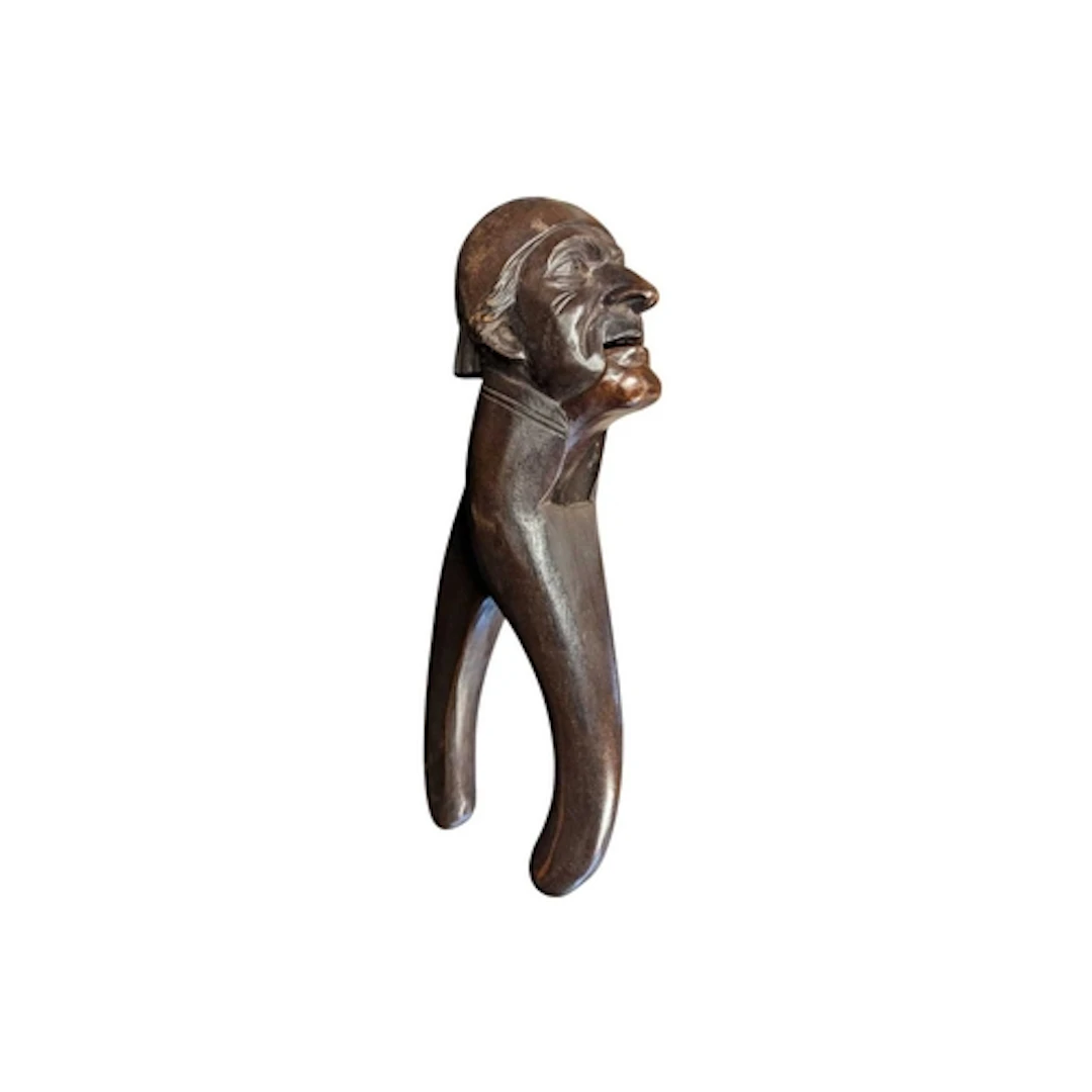 An early 20th century Black Forrest carved treen nutcracker....