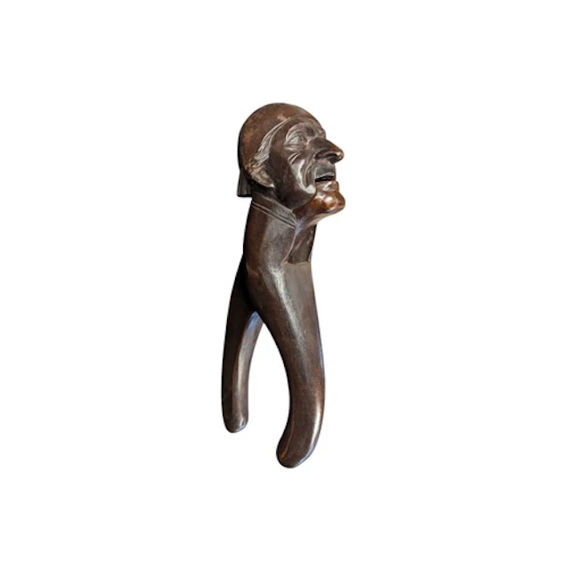 An early 20th century Black Forrest carved treen nutcracker....
