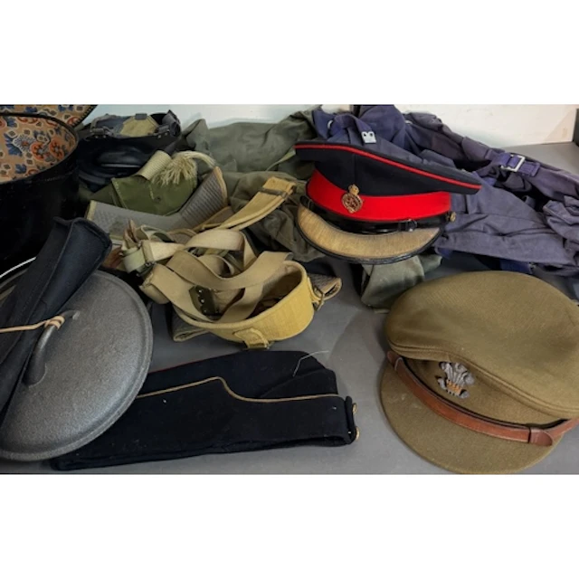 A selection of military uniform and caps various ages and re...