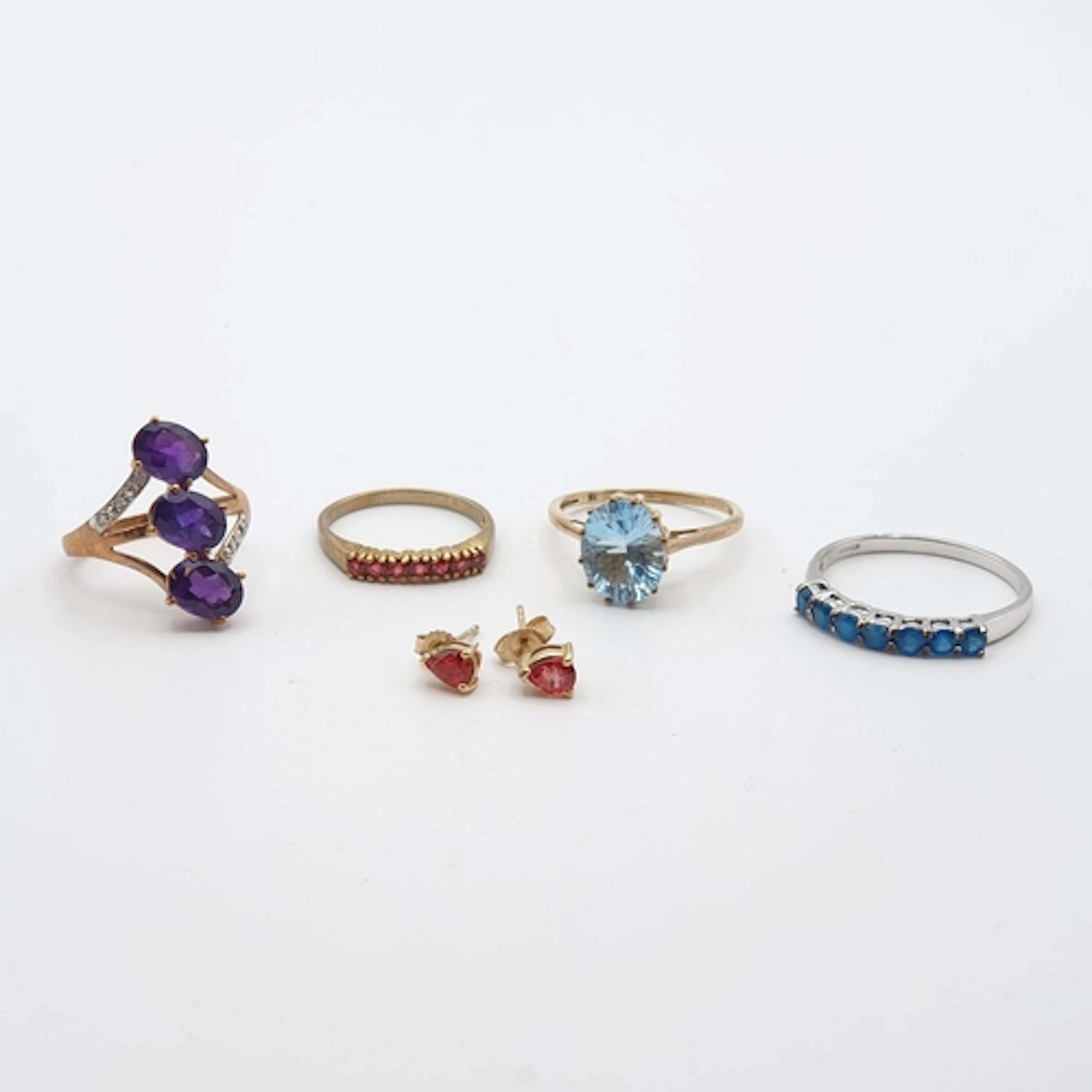Four Dress Rings set various stones including; amethyst, apa...
