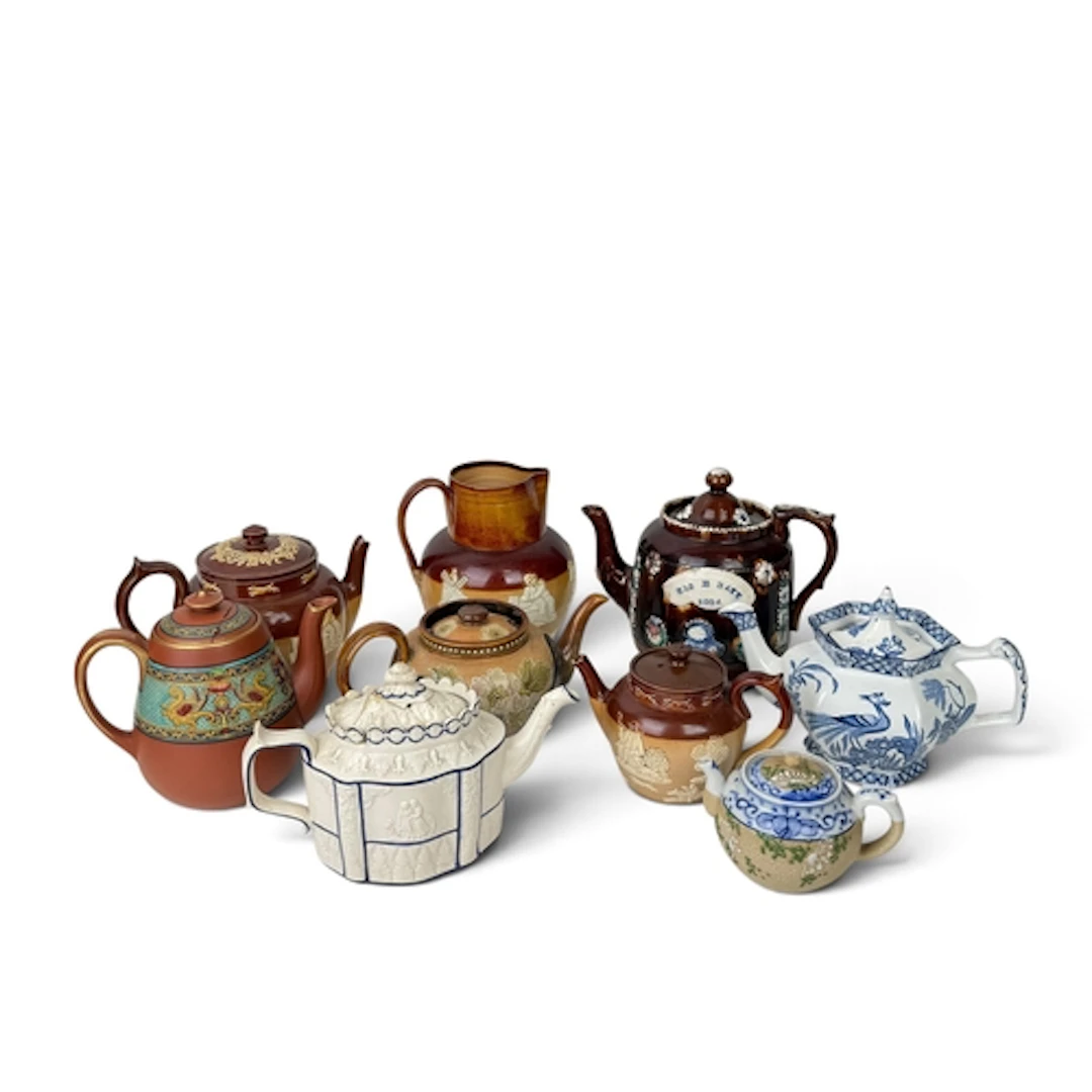 A GROUP OF MOSTLY ENGLISH 19TH CENTURY TEAPOTS To include Vi...