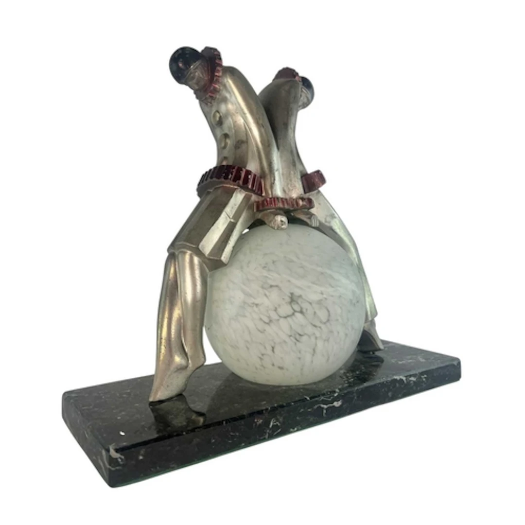 An Art Deco early 20th century Exe patinated aluminium and m...