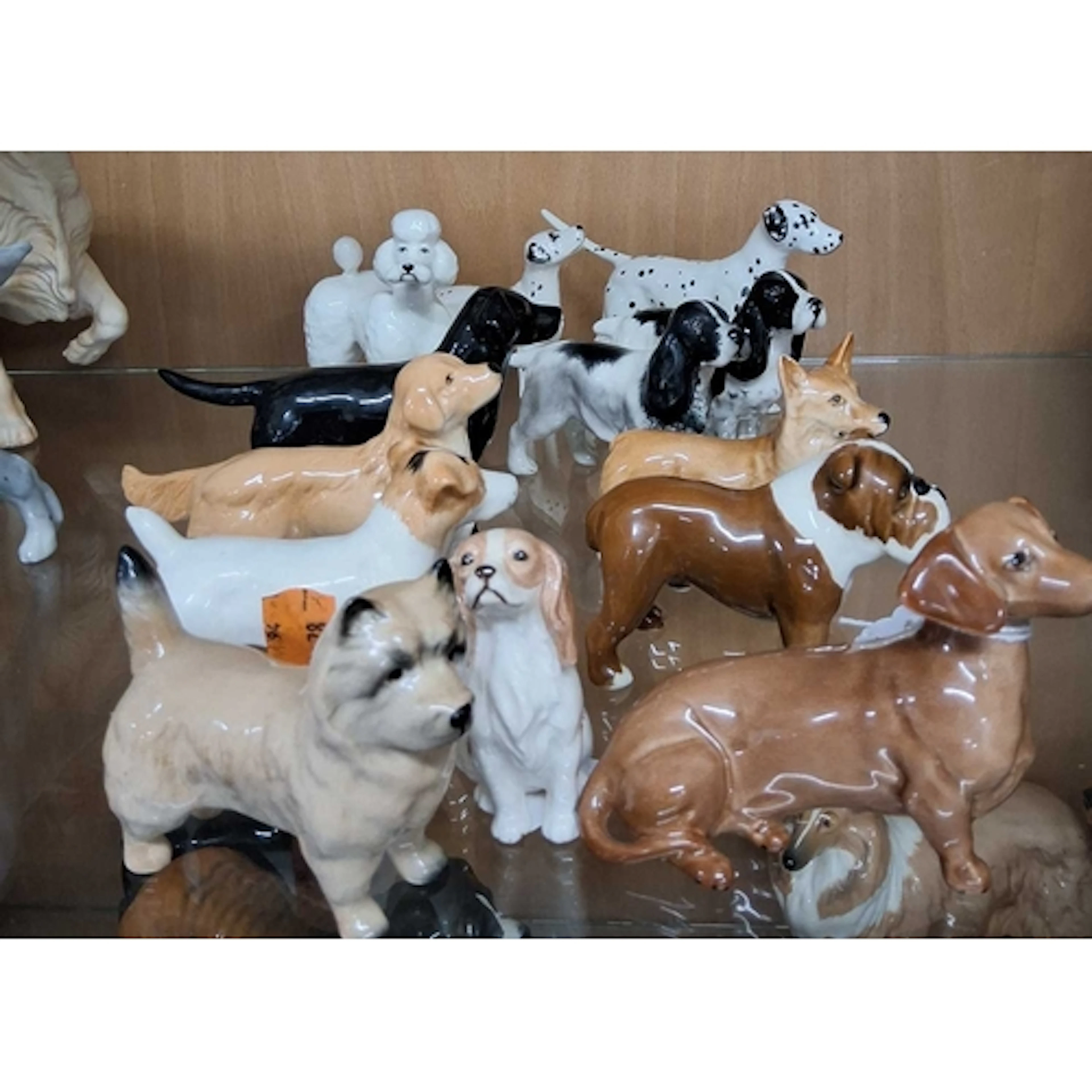 A GROUP OF THIRTEEN SMALL BESWICK DOG FIGURES, comprising a ...
