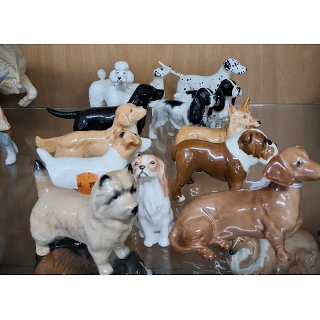 A GROUP OF THIRTEEN SMALL BESWICK DOG FIGURES, comprising a ...