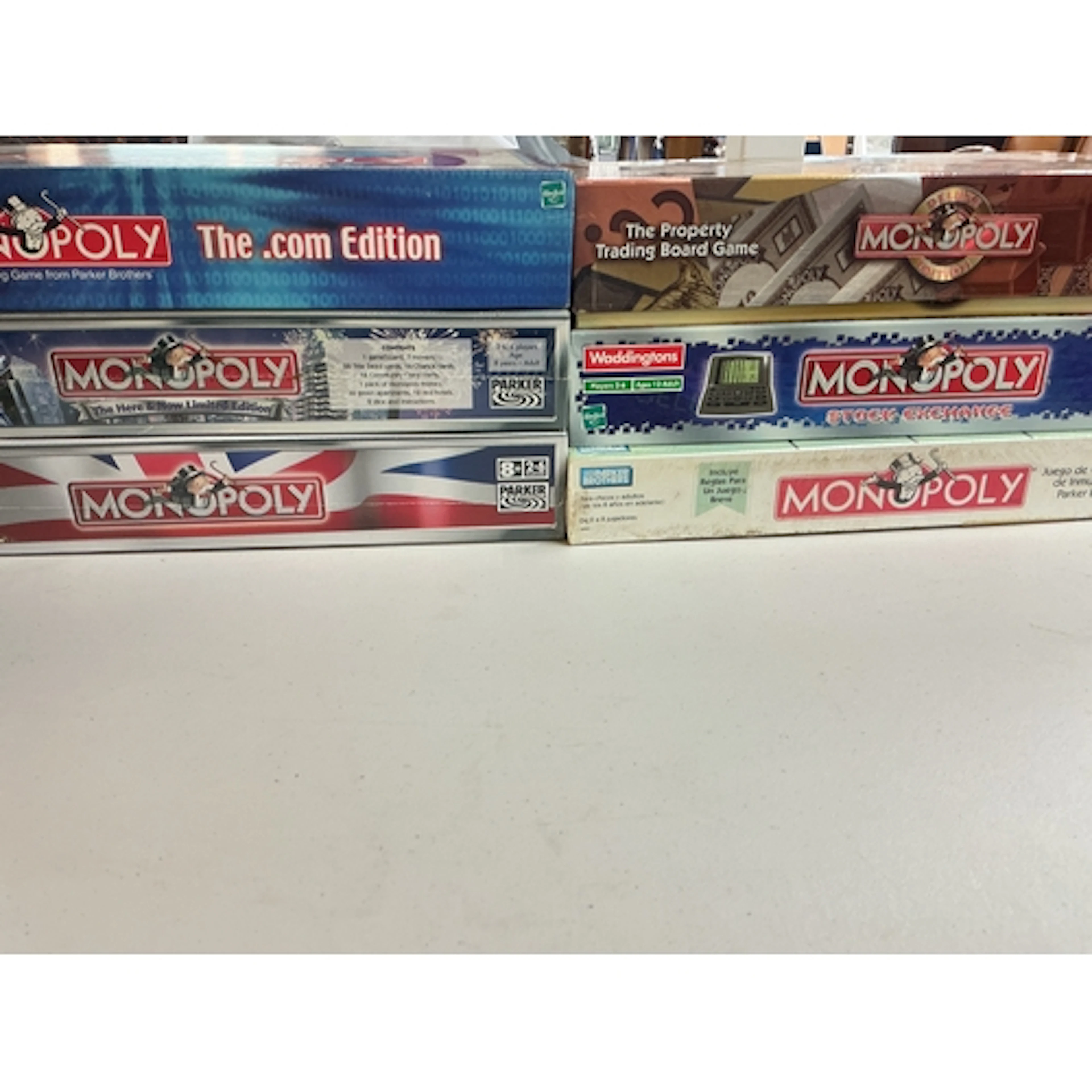 A Collection Of Monopoly Board Games (Some Sealed) And A Sta...