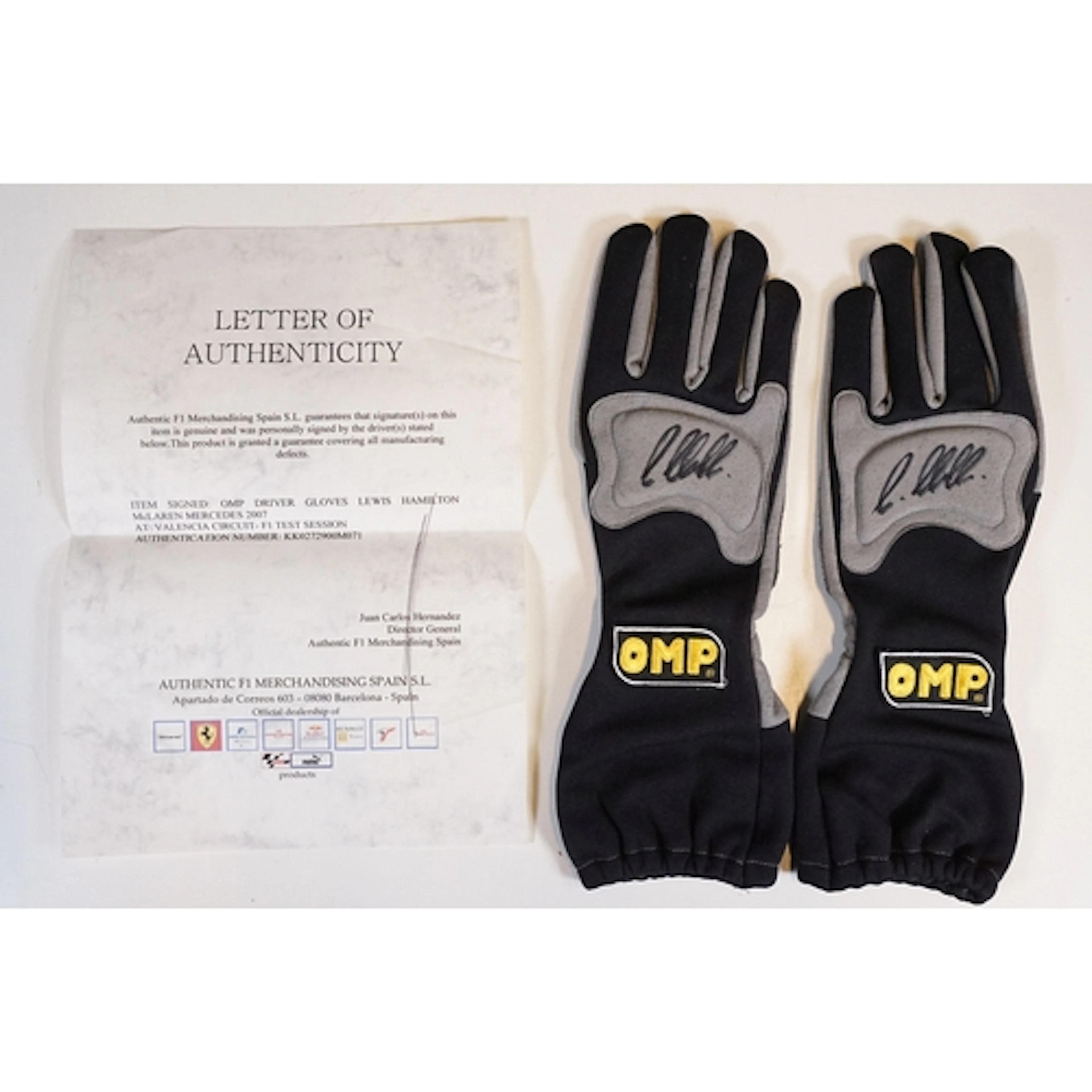 A pair of Lewis Hamilton signed OMP Driver gloves signed at ...