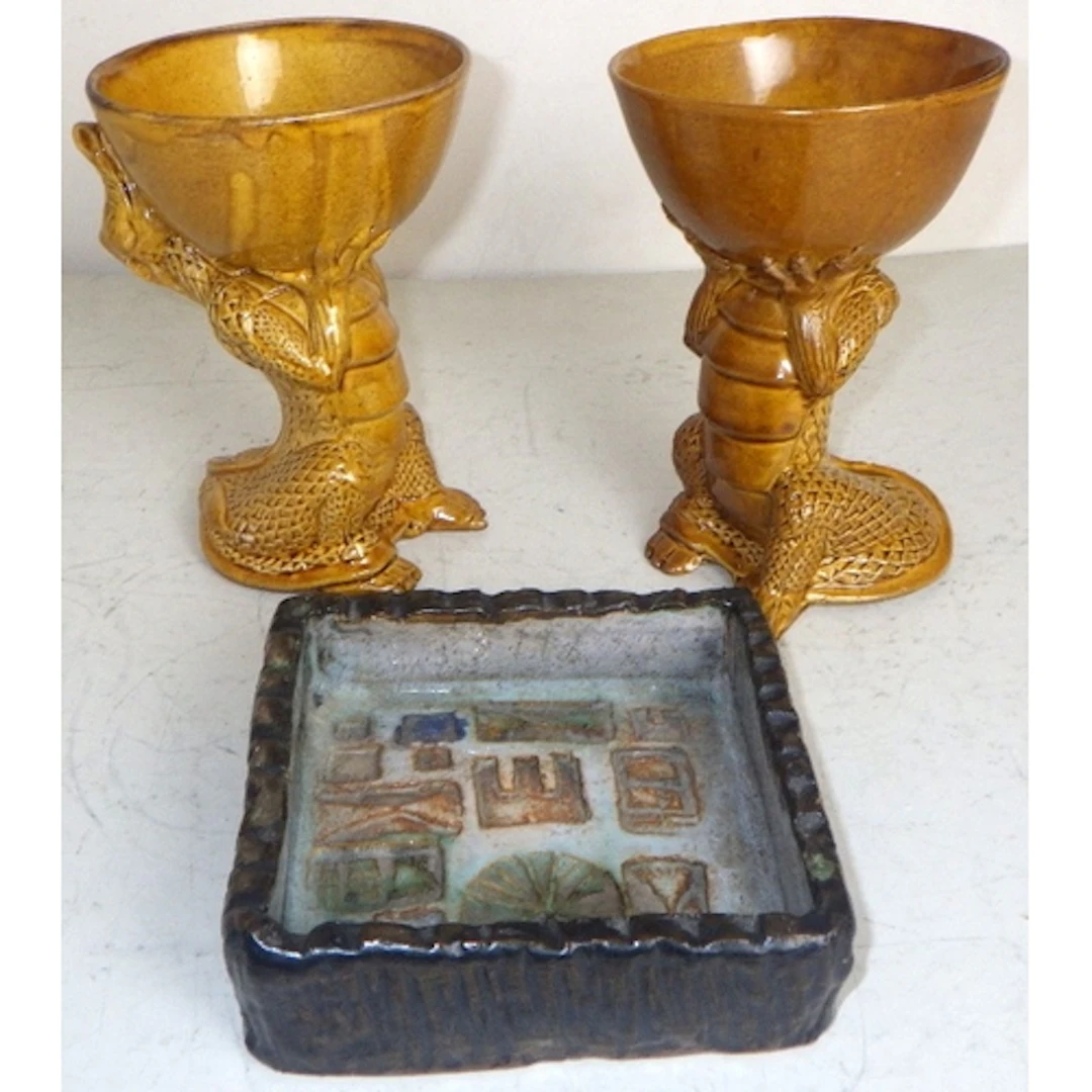 A pair of grotesque dragon goblets and a small Studio potter...