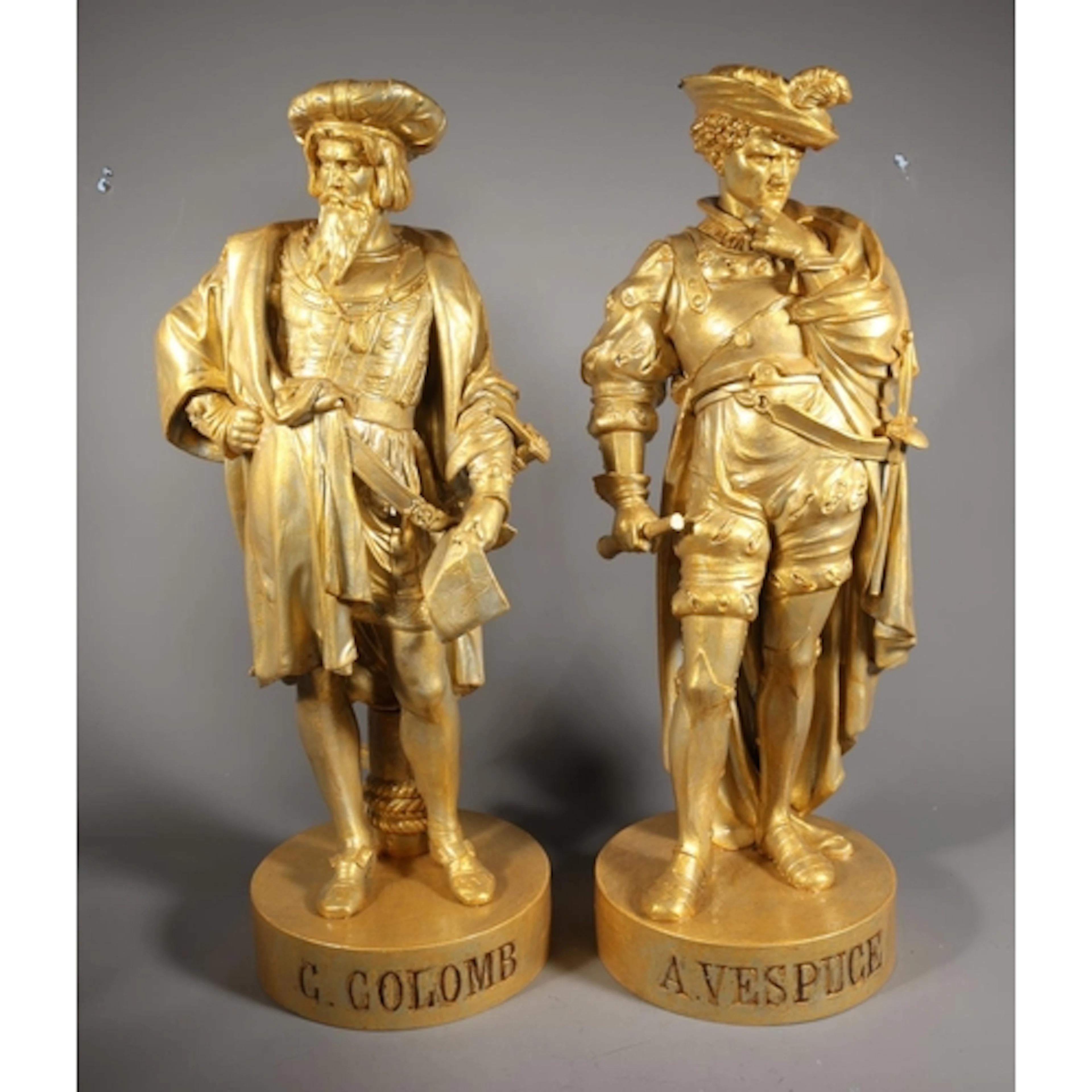 Pair of cast metal statues modelled as 15th century explorer...