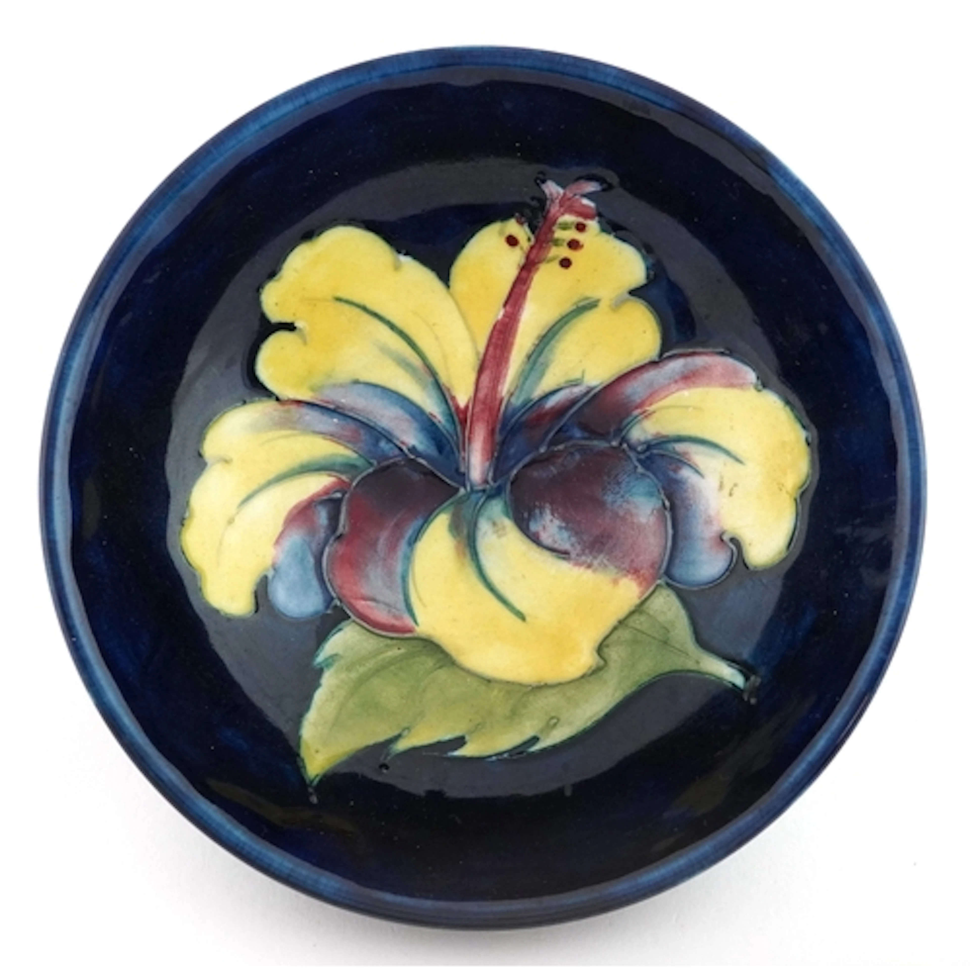 Walter Moorcroft Hibiscus pattern pottery bowl, bearing pape...