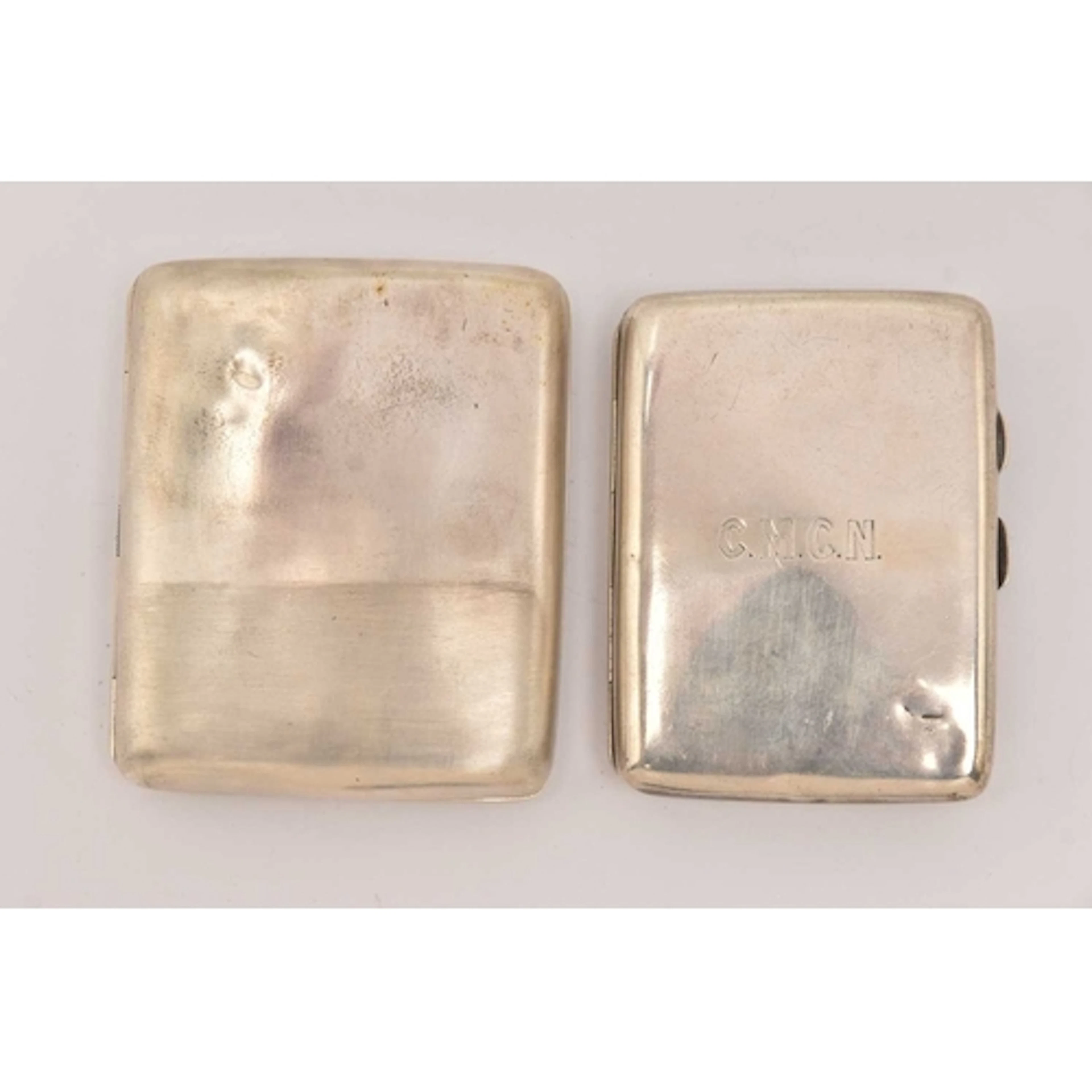 TWO SILVER CIGARETTE CASES, both of a polished rectangular f...