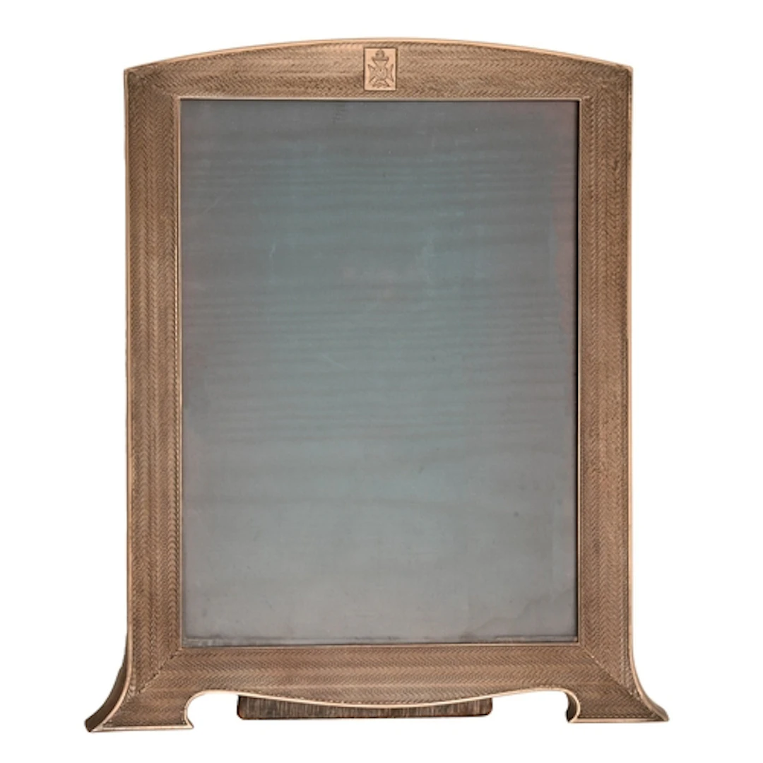 A George V silver photograph frame, engine turned, backed on...