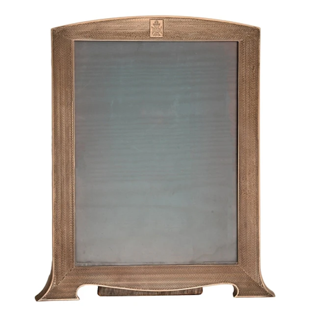 A George V silver photograph frame, engine turned, backed on...
