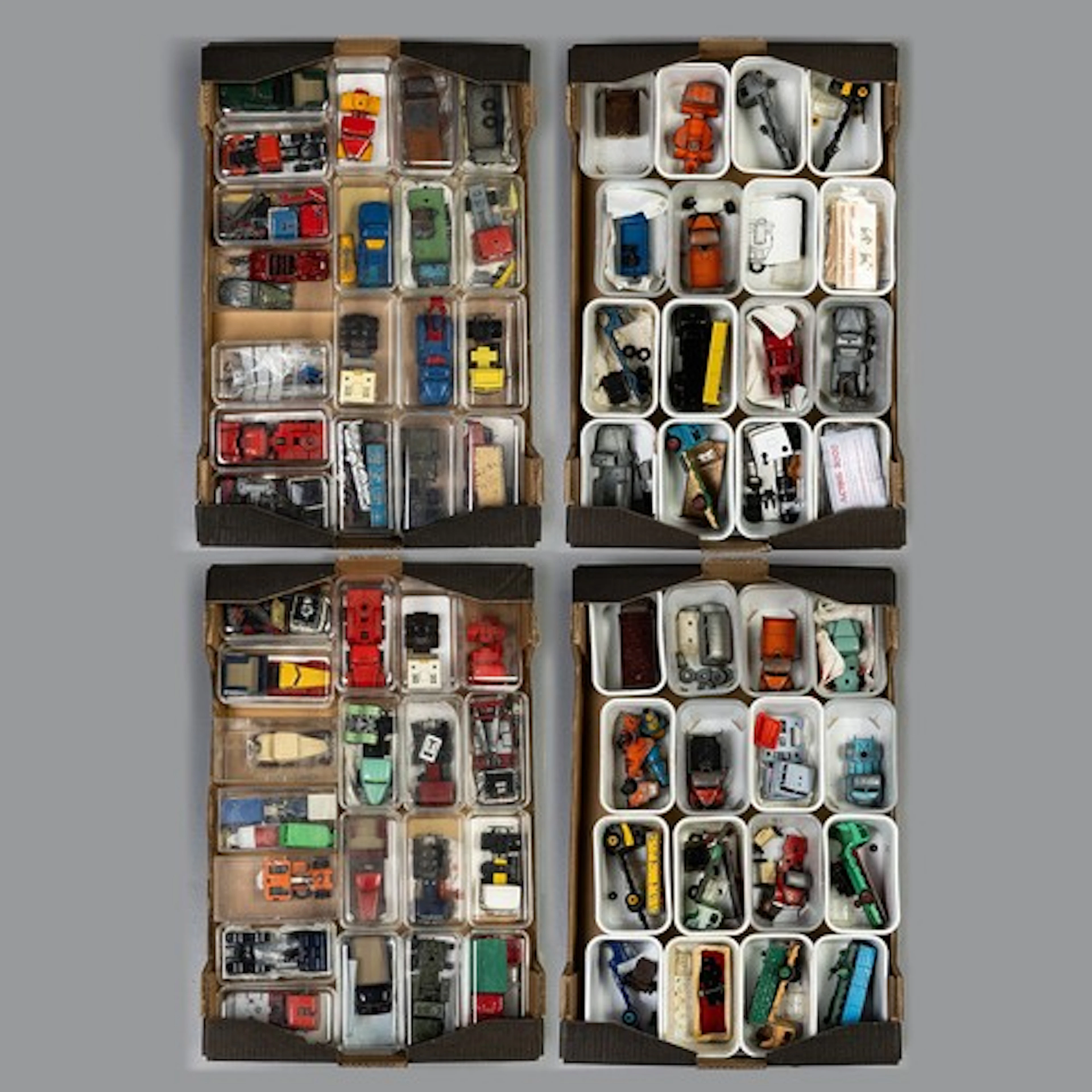 Four trays containing 70 plastic boxes/cartons each one cont...