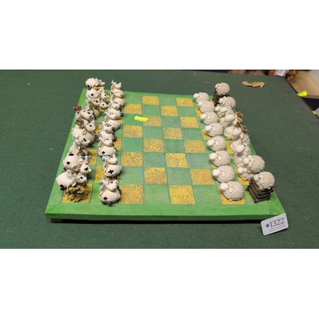 Novelty chess set with hand-painted resin cows opposing shee...