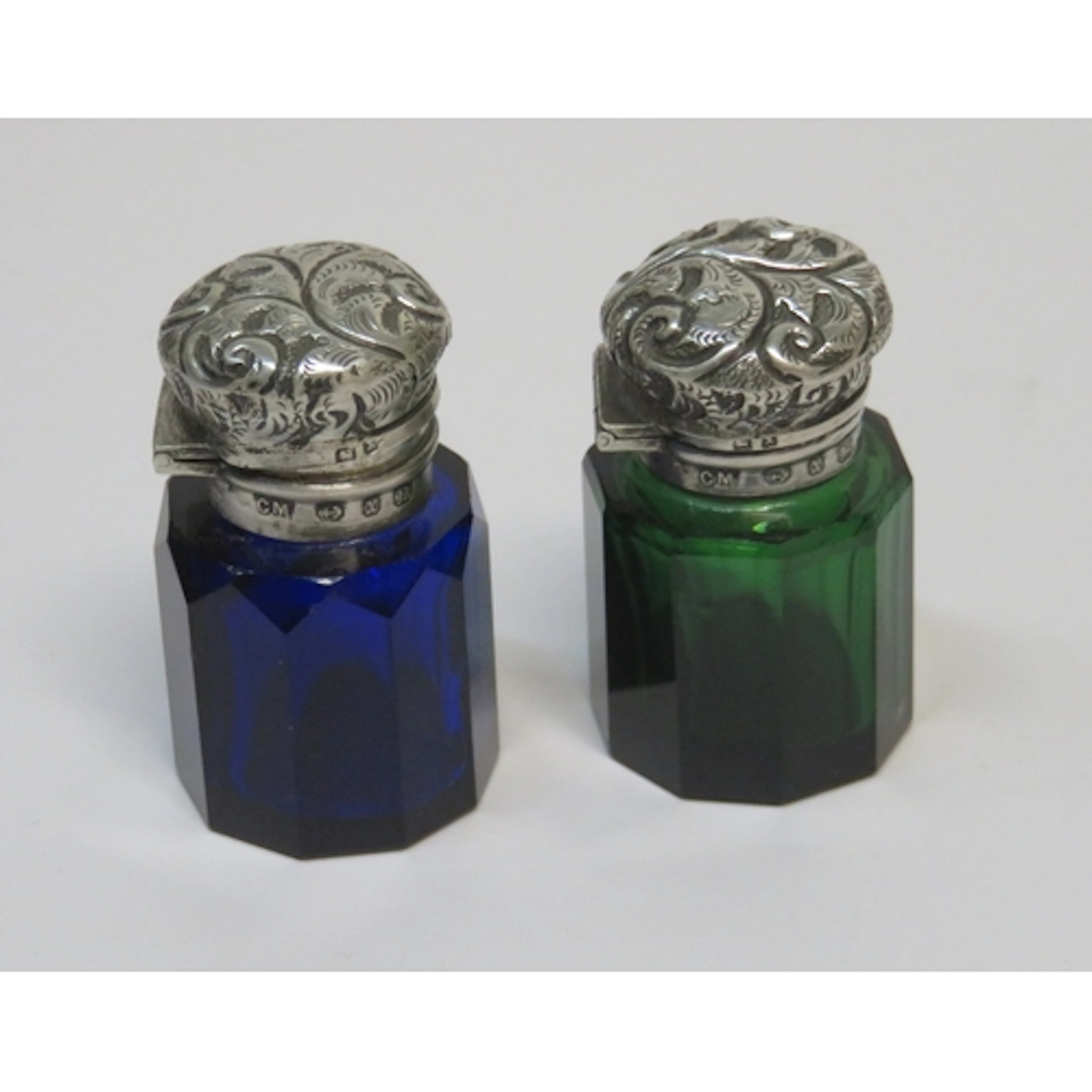 Two late 19th Century silver topped blue and green coloured ...
