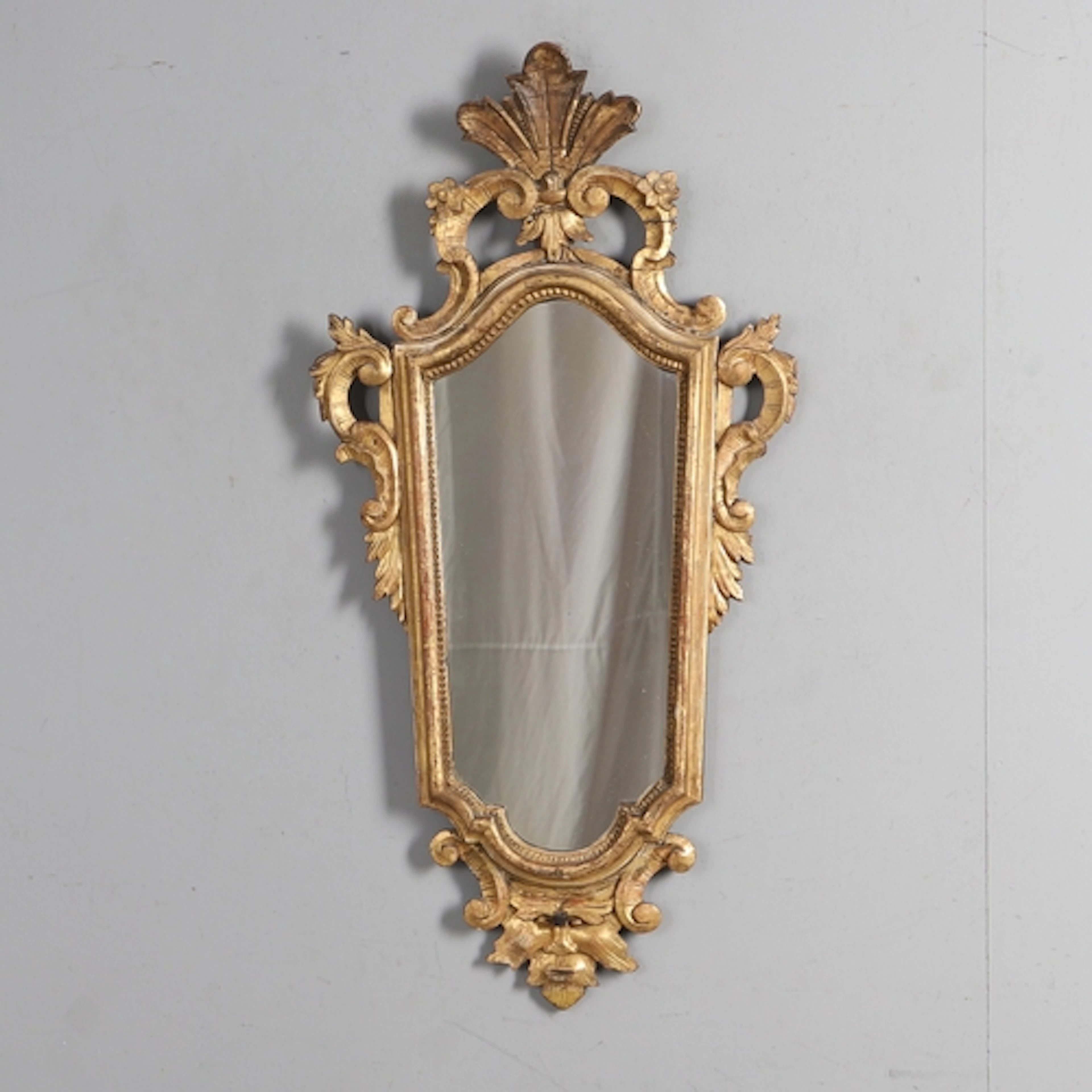 AN 18TH CENTURY ITALIAN GILTWOOD GIRANDOLE. the later taperi...