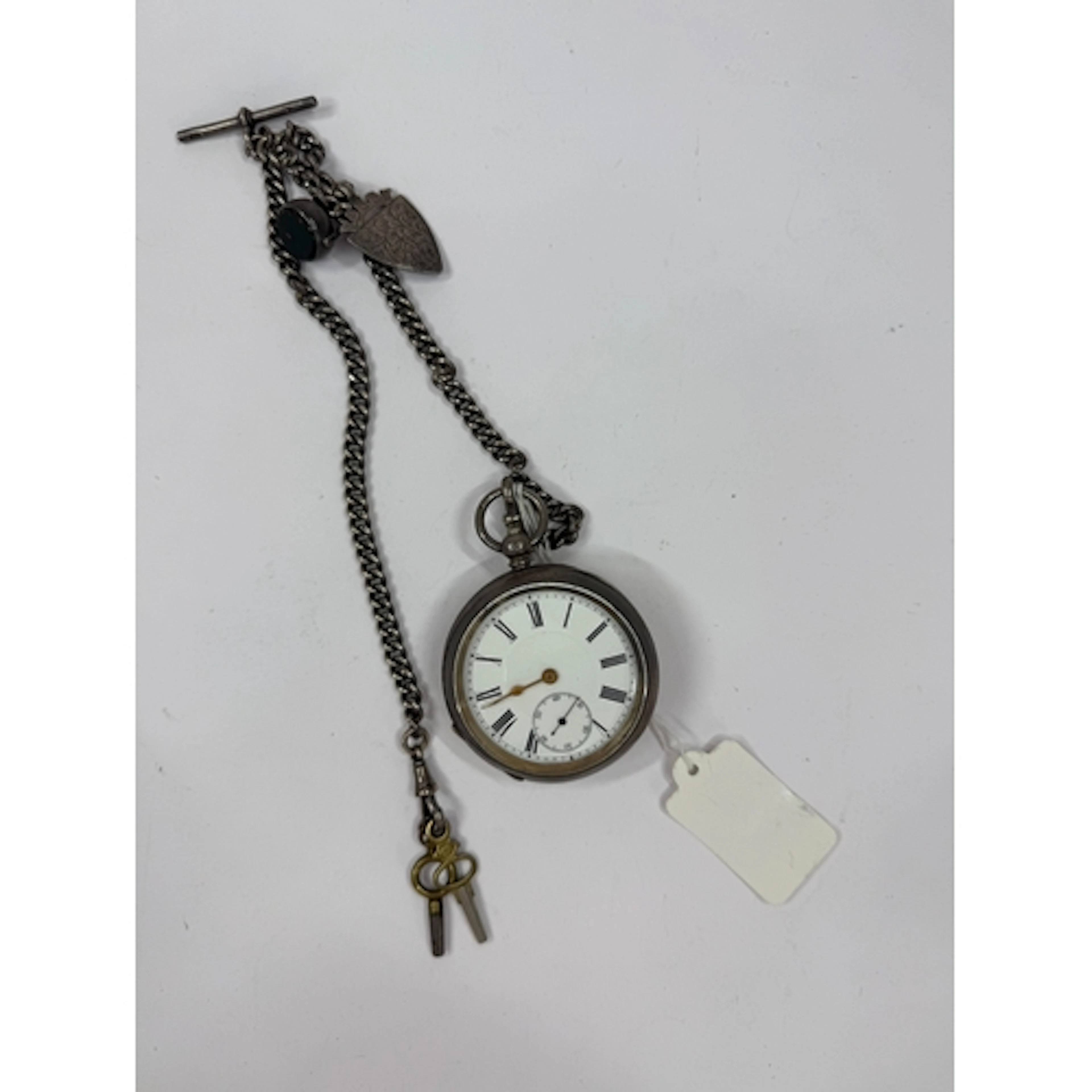 Watches: a white metal open faced pocket watch, bearing Swis...