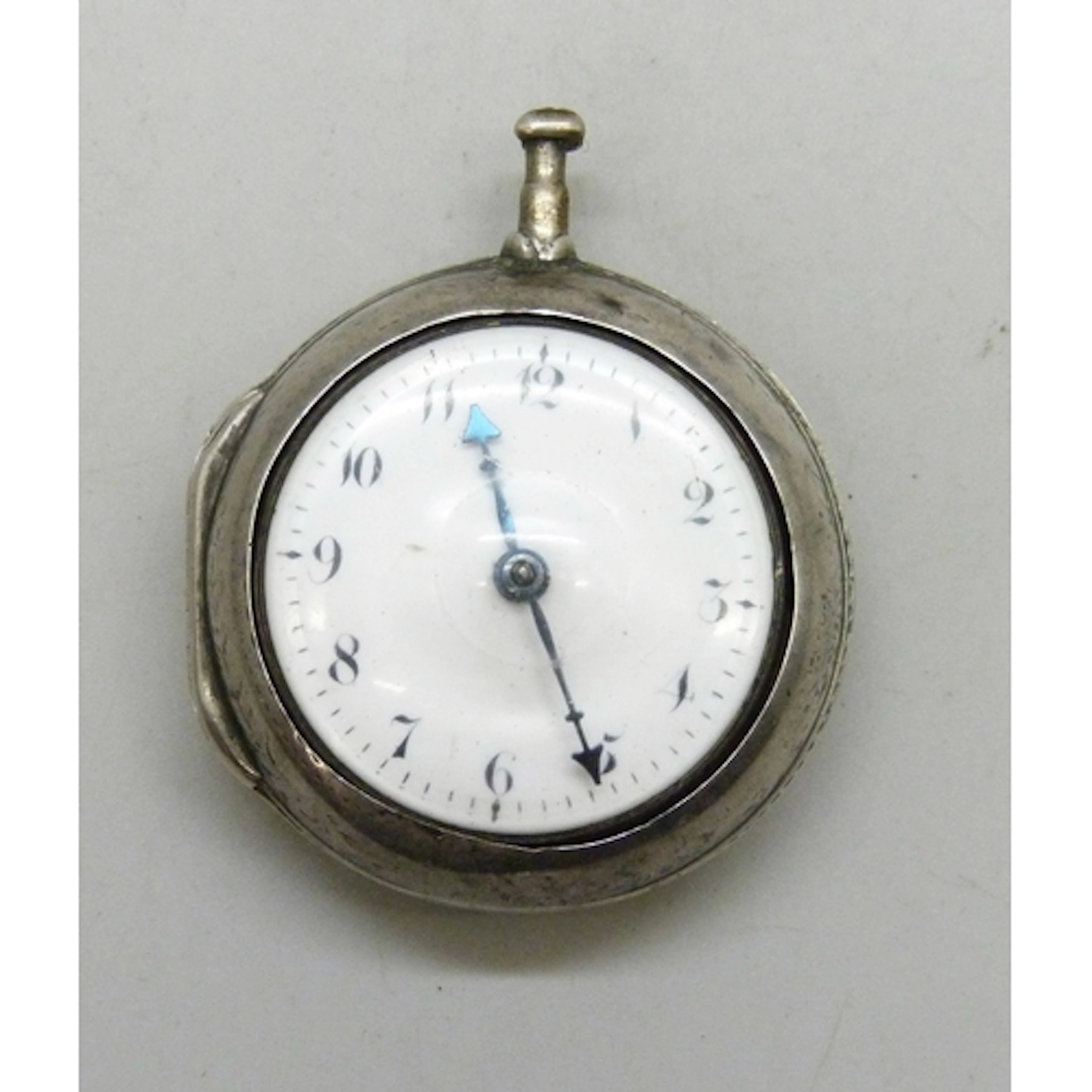 A white metal pair cased pocket watch, Tomkins Graham signed...