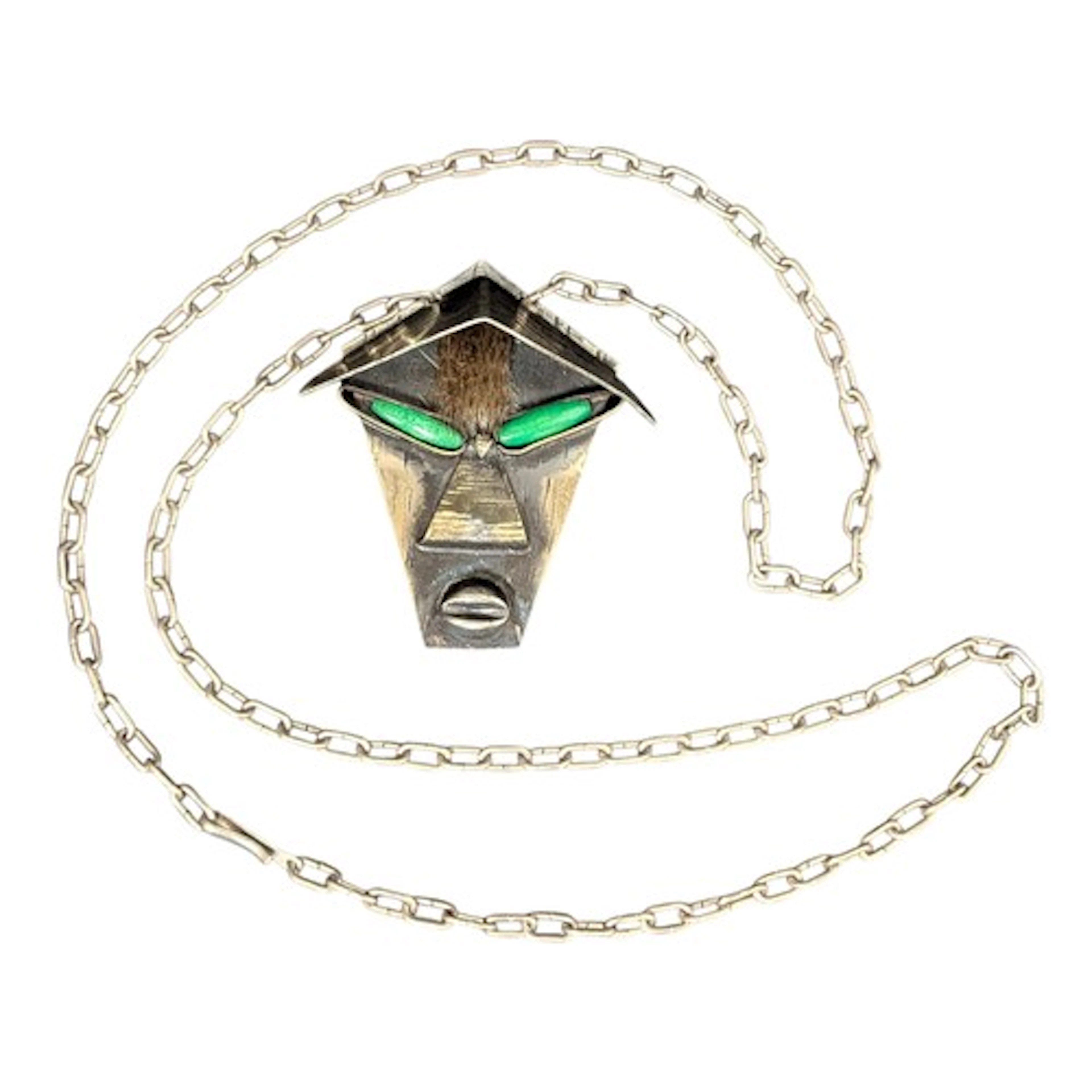 A mid-century Modernist white metal necklace pendant, as a t...
