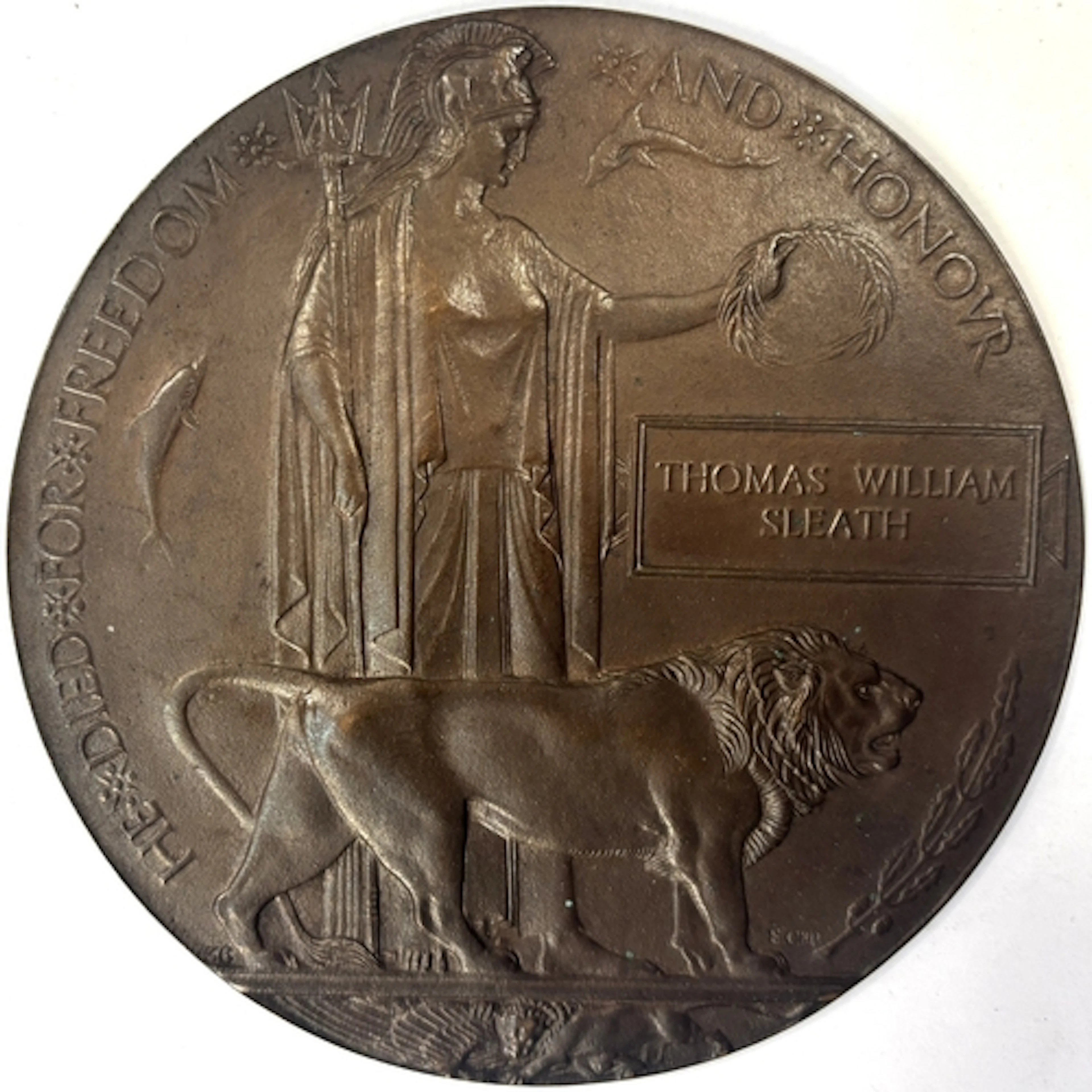 A WWI death plaque awarded to Thomas William Sleath PTE 1/4t...