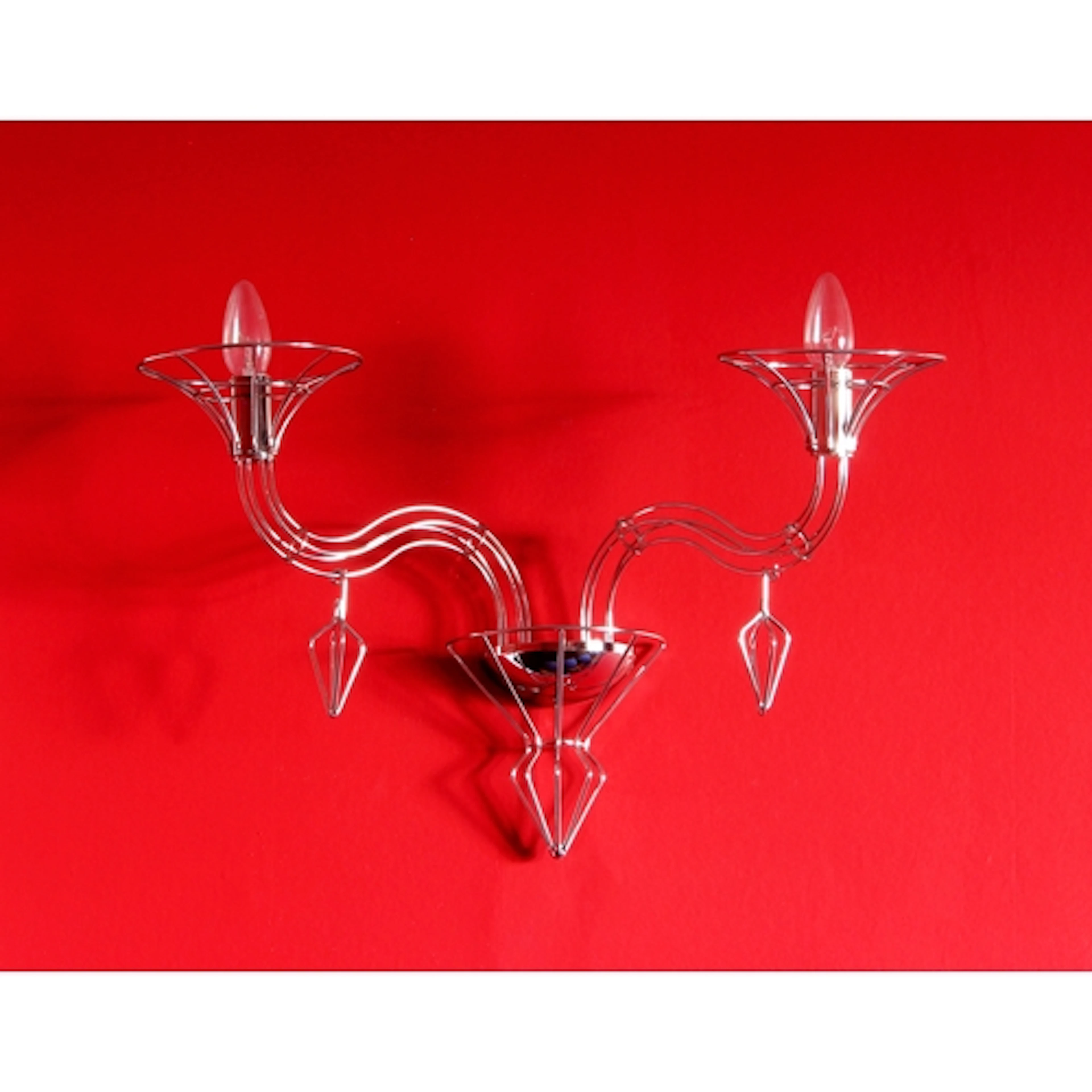 A set of four modern chrome twin branch wall lights - of tra...