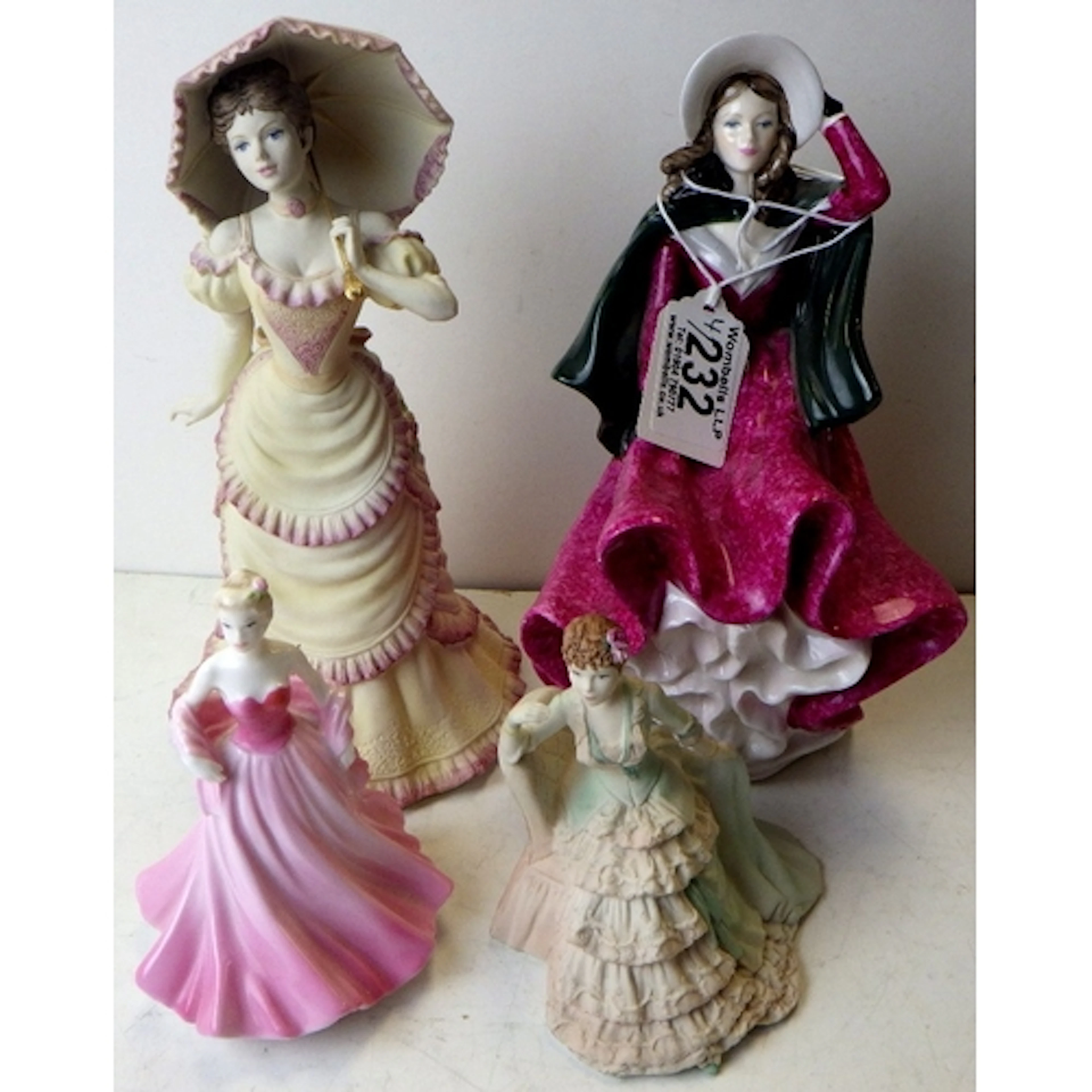 A group of four Coalport figurines