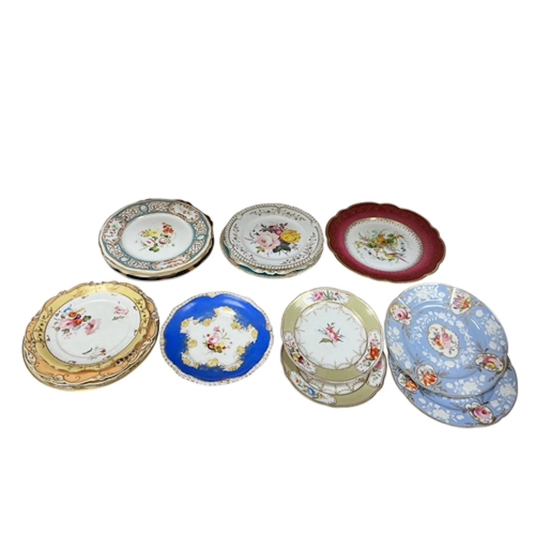 Seventeen English porcelain flower decorated plates and dish...