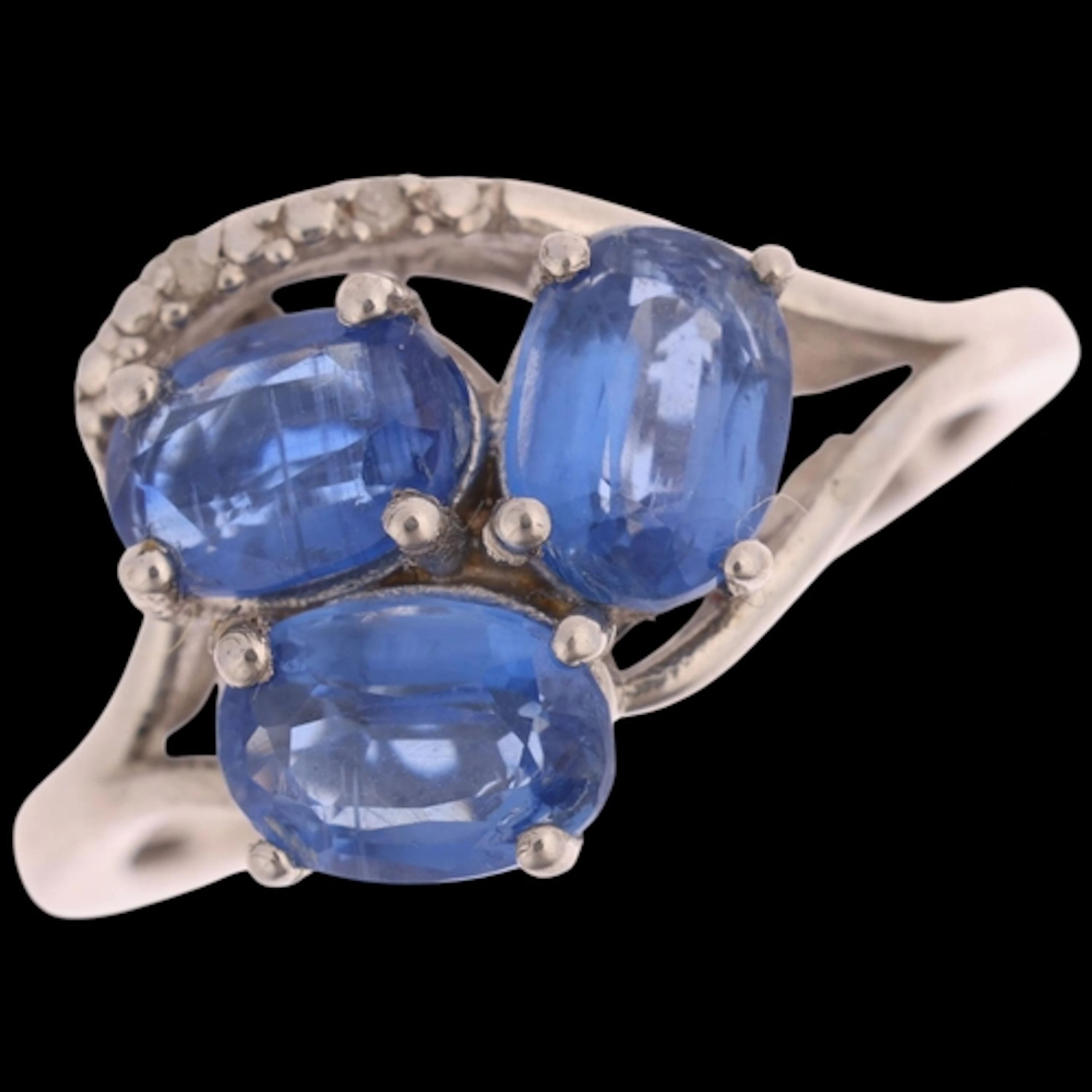 A sterling silver kyanite and diamond ring, claw set with ov...