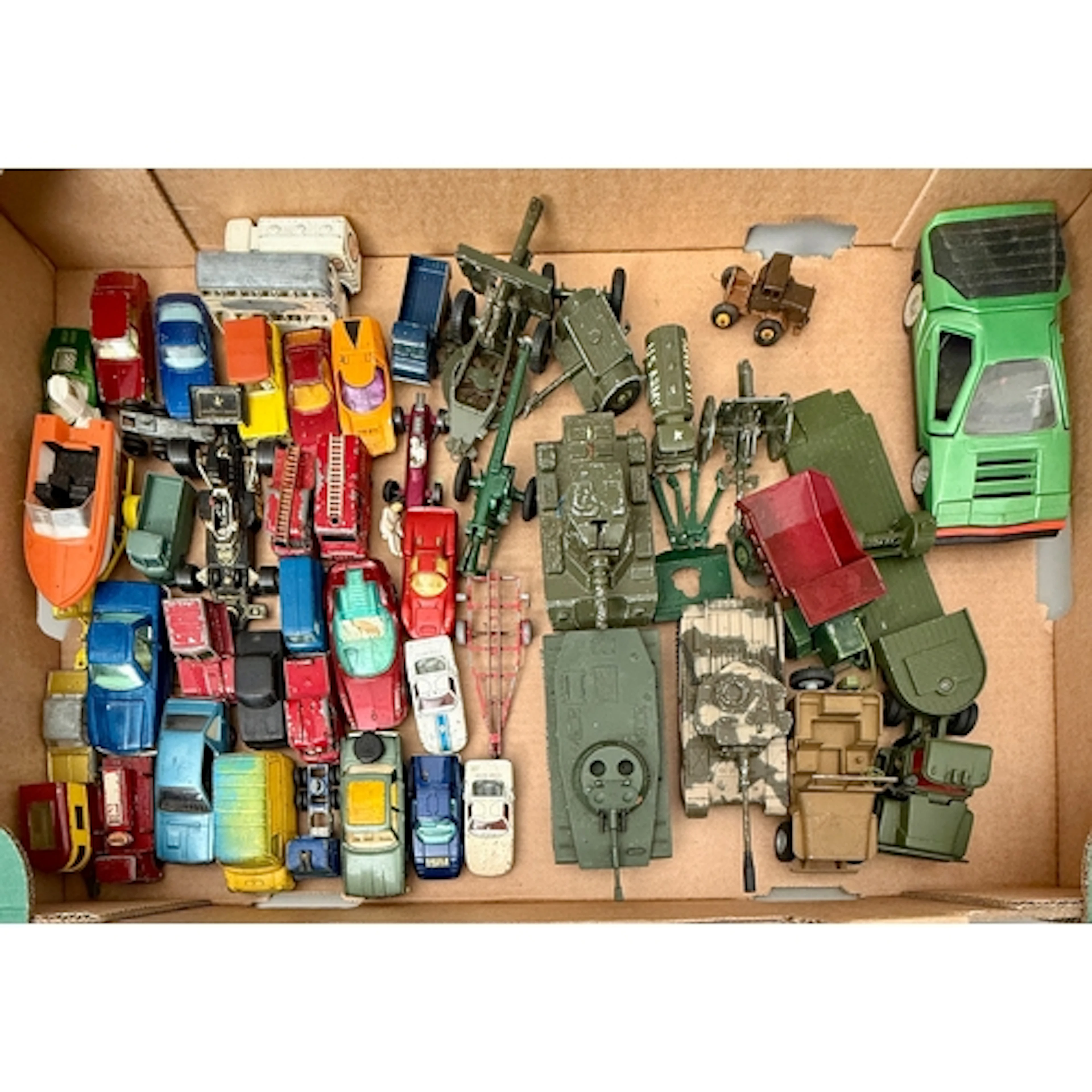 A collection of 1960s-70s diecast toy cars and military vehi...