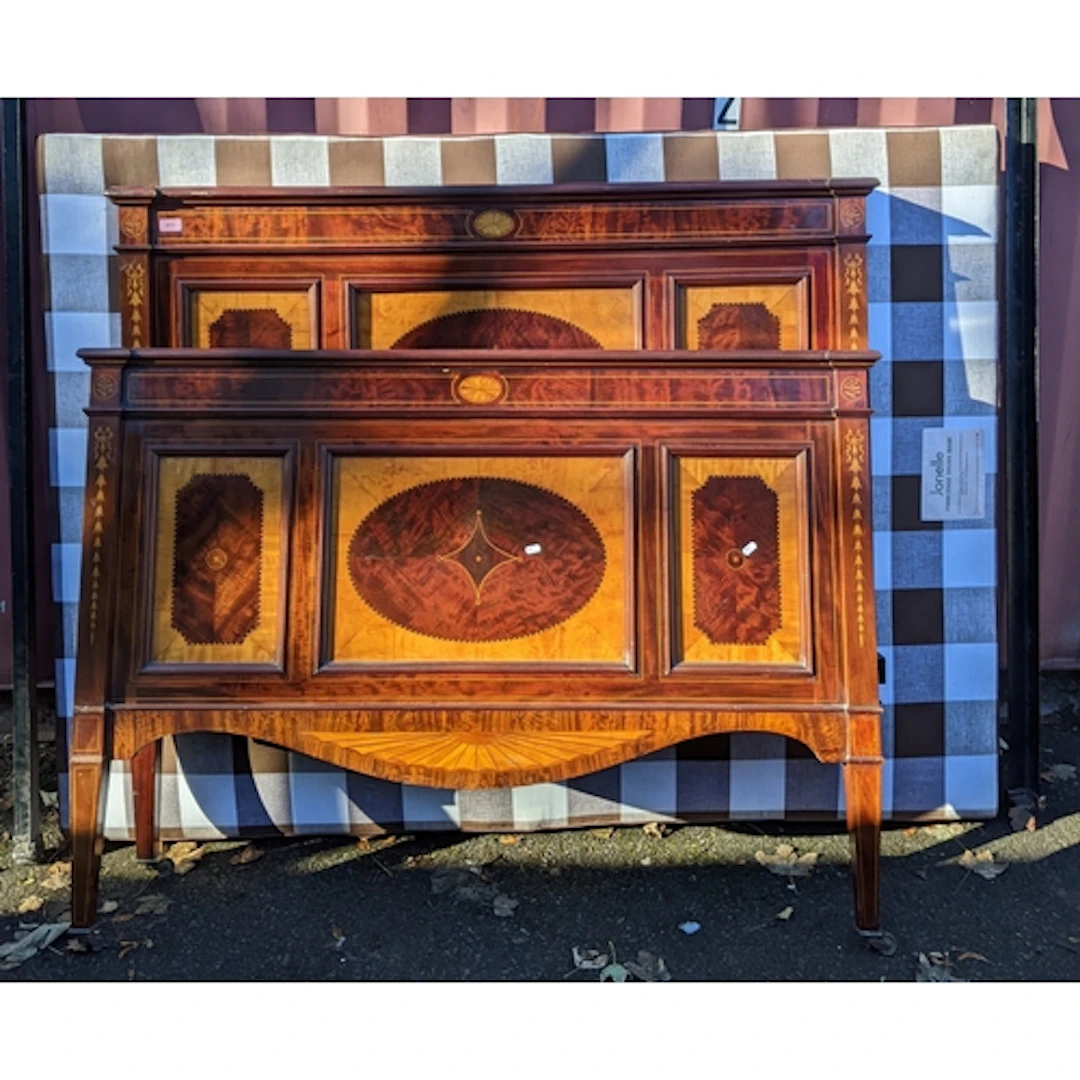 An Edwardian inlaid mahogany single bed, head and footboards...