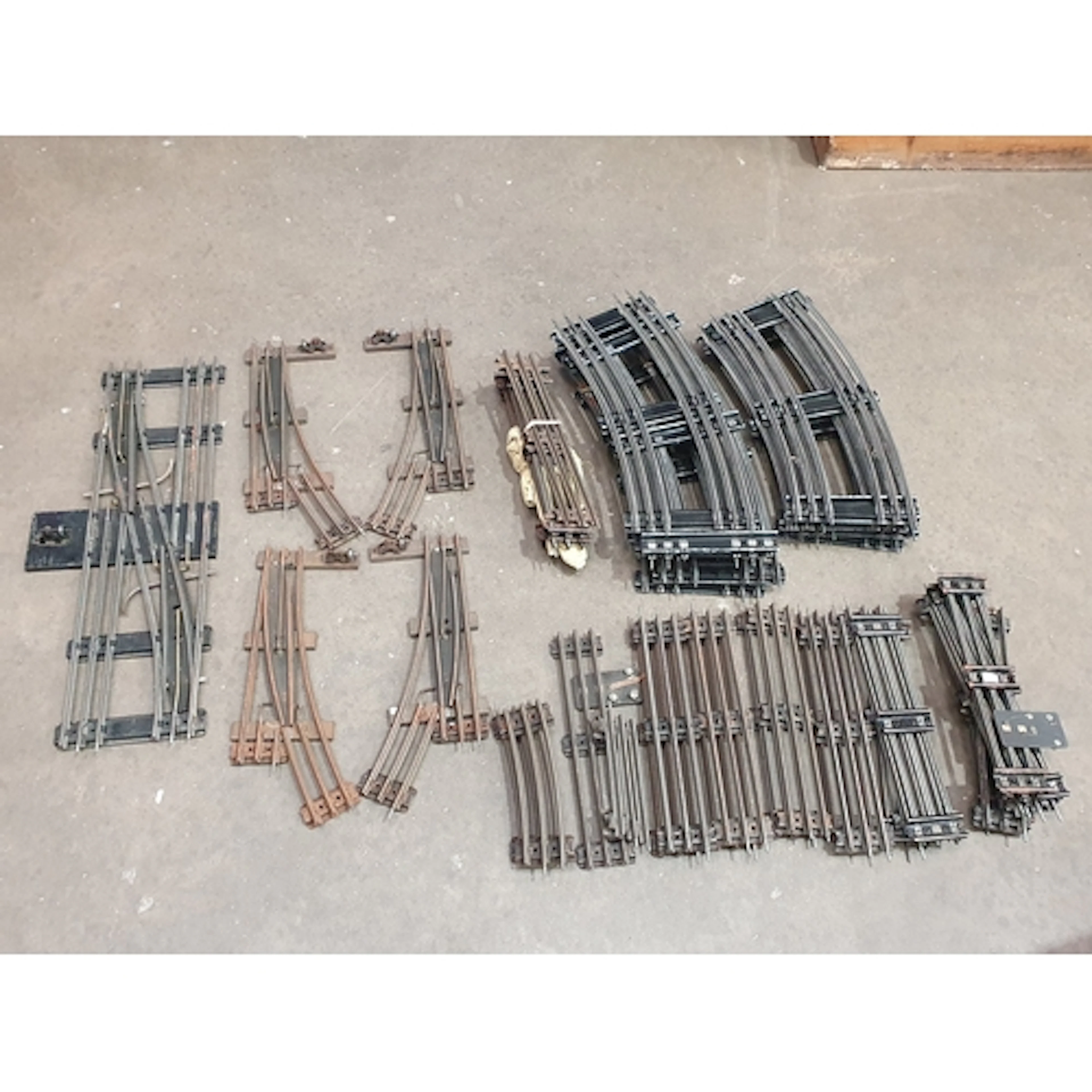 A quantity of Hornby 0 gauge 3-rail tinplate Track including...