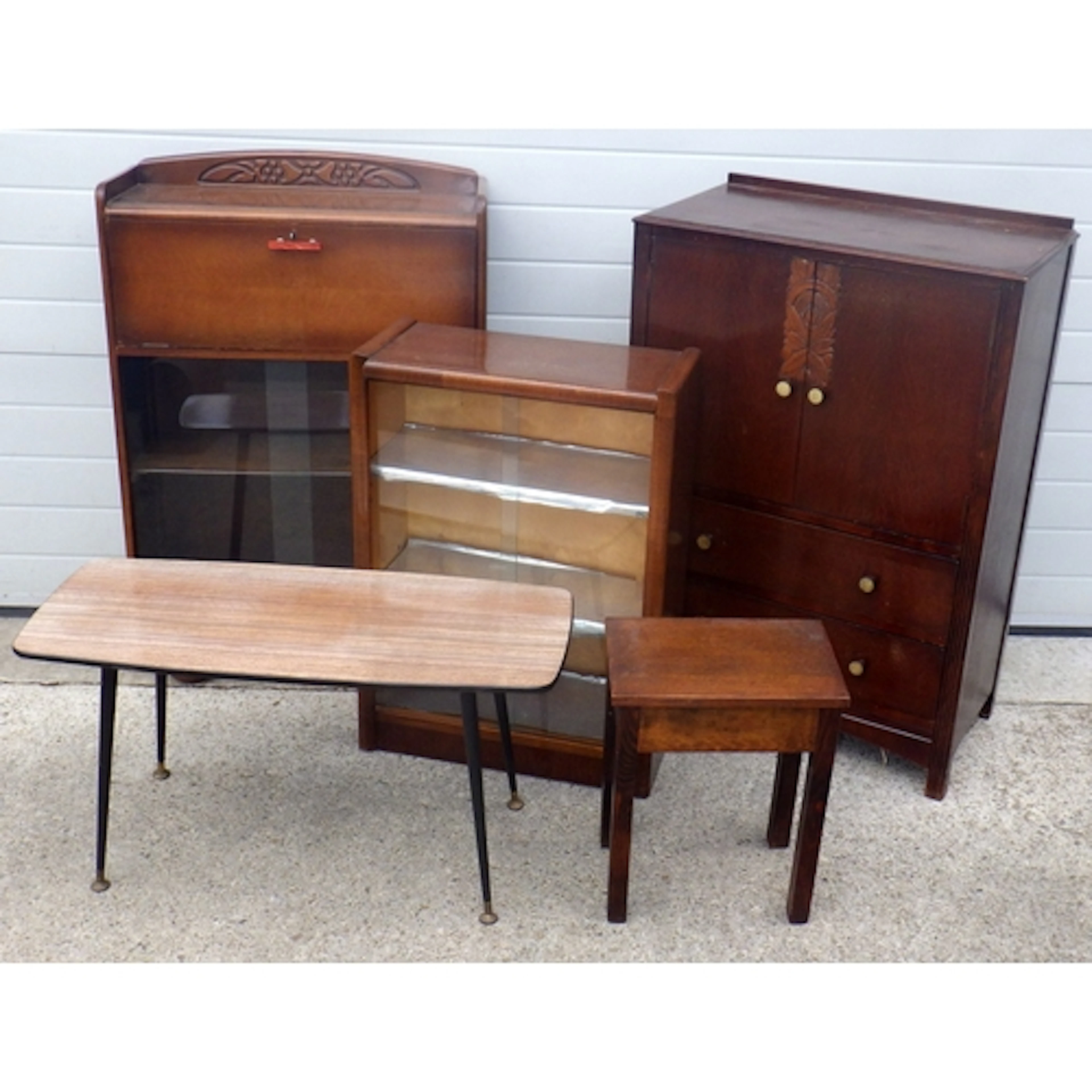 An oak/ply tallboy, two sliding door bookcases, coffee table...