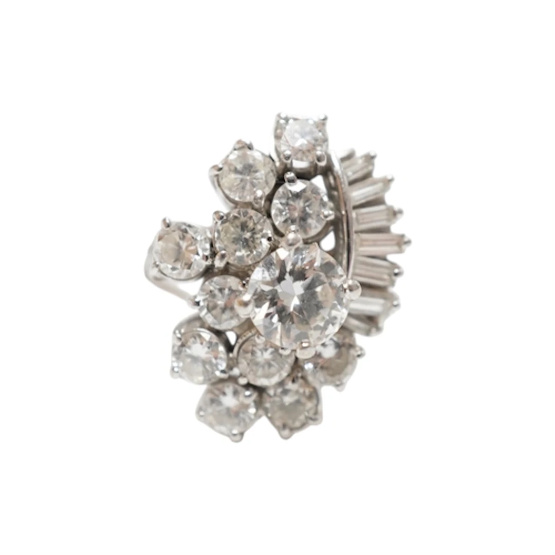 A diamond cocktail ring, 1970s, designed as an abstract clus...