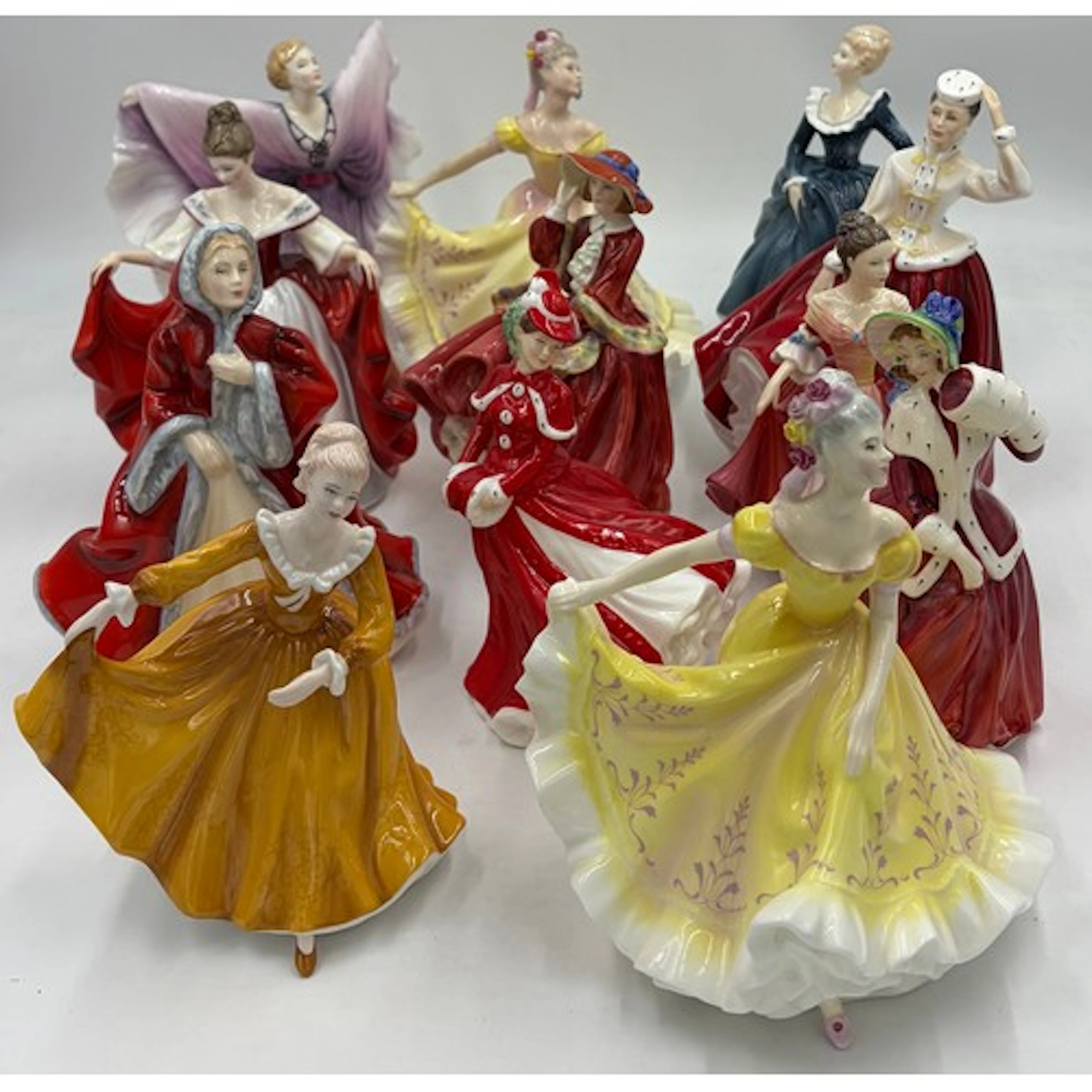 A collection of Royal Doulton figurines to include: 2 x 'Nin...