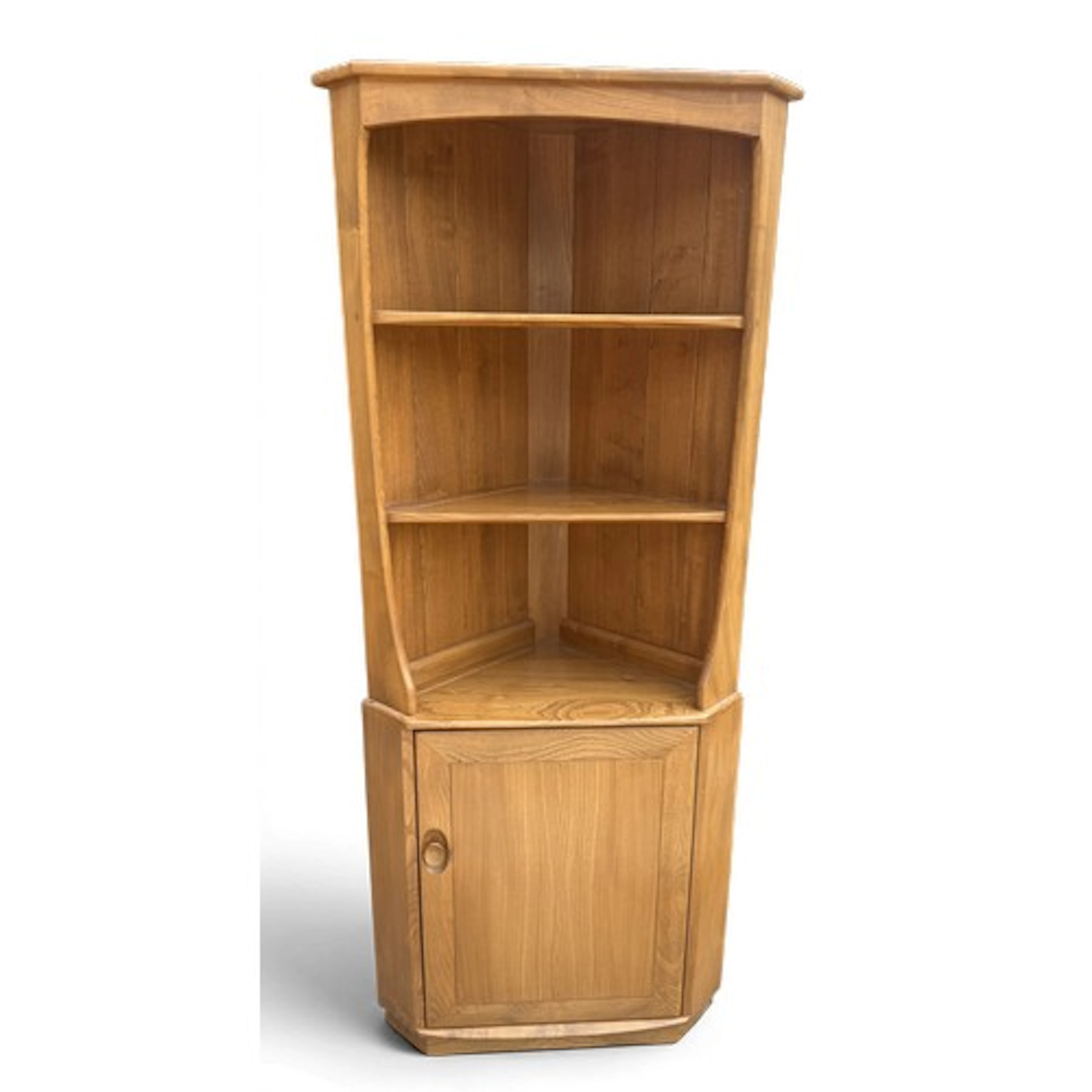 An Ercol corner cabinet with shelves above a cupboard door. ...