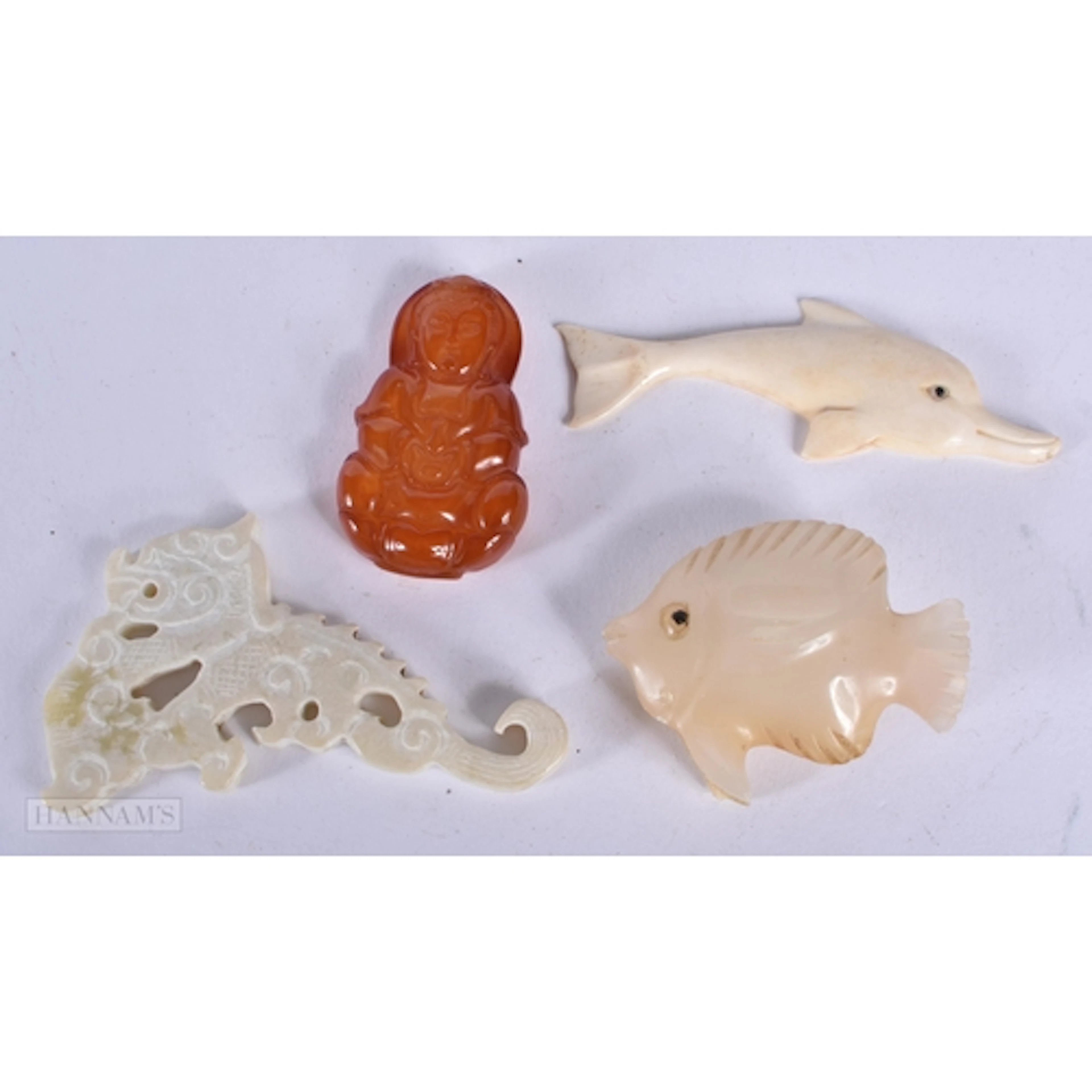 A collection of carved jade, Hardstone and bone items 7cm (4...