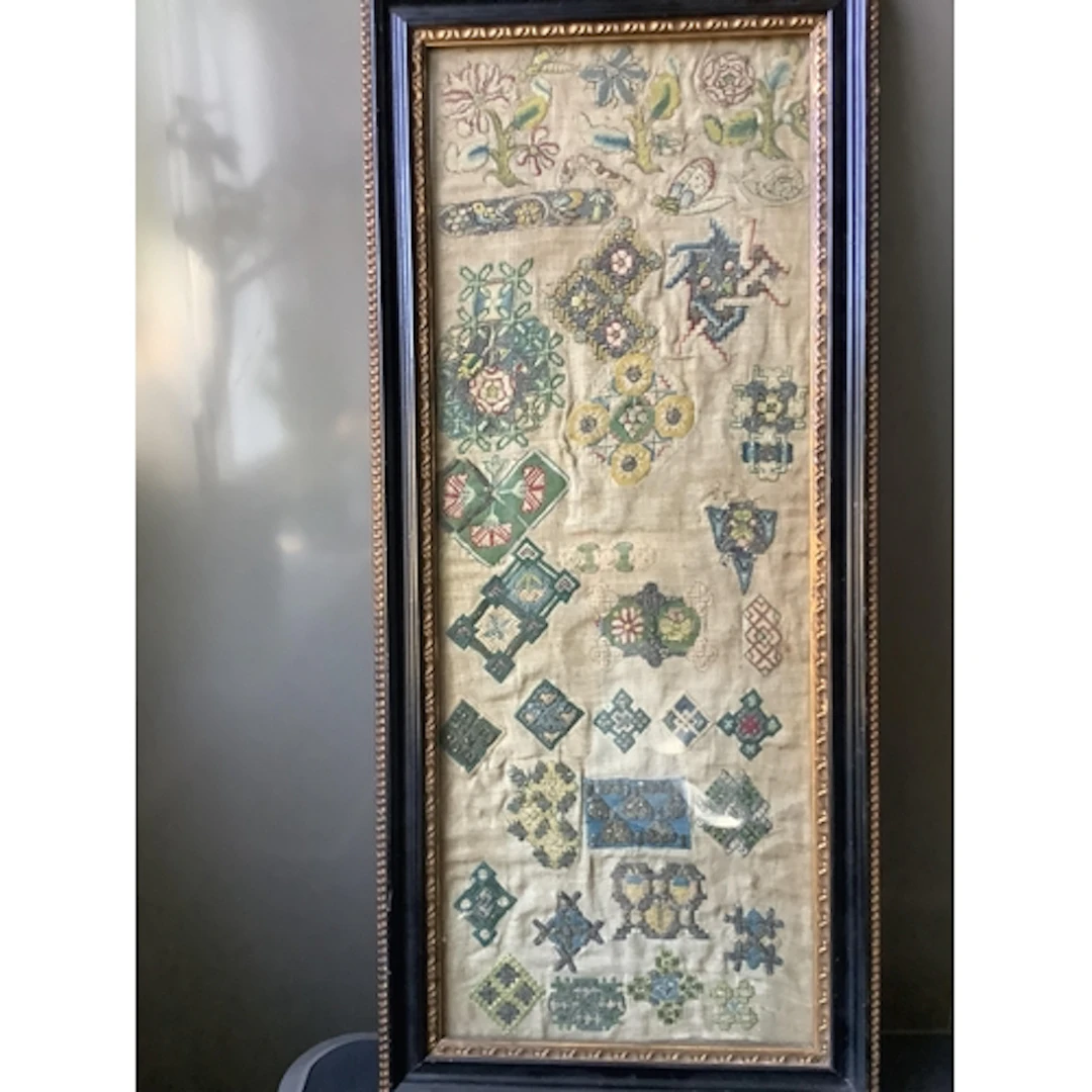 A rare early 17th century spot motif sampler. Worked on fine...