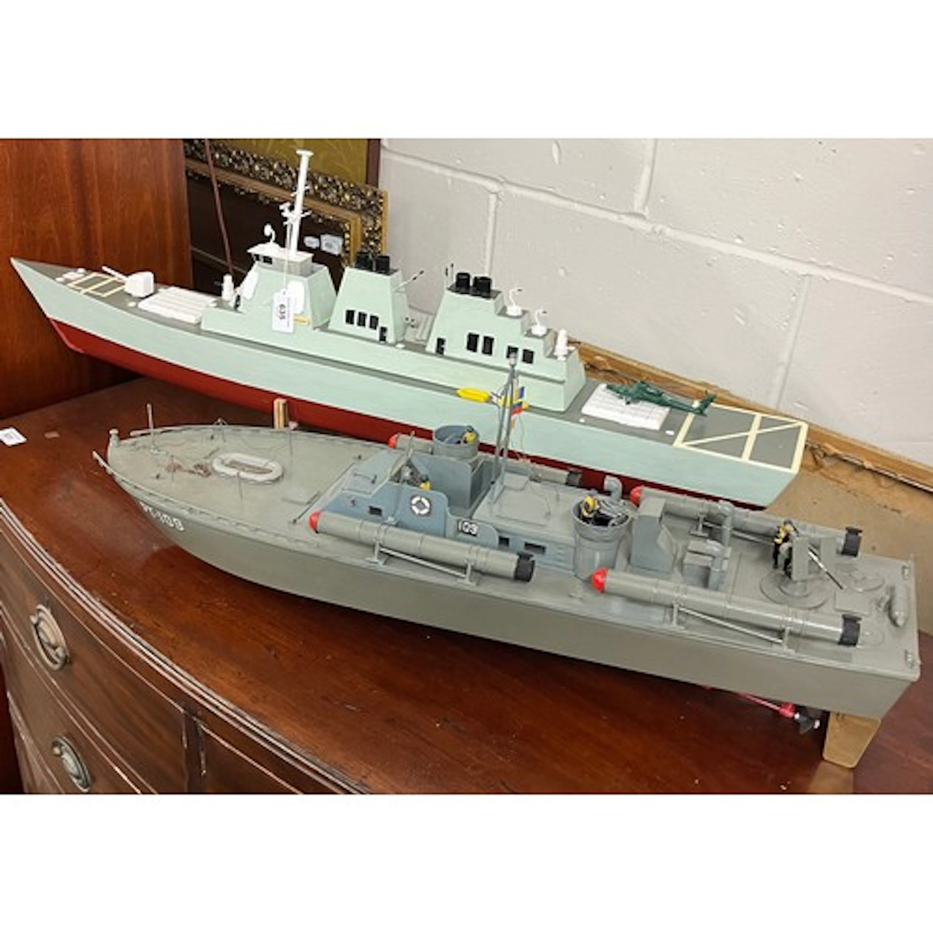 Two radio control model naval ships.